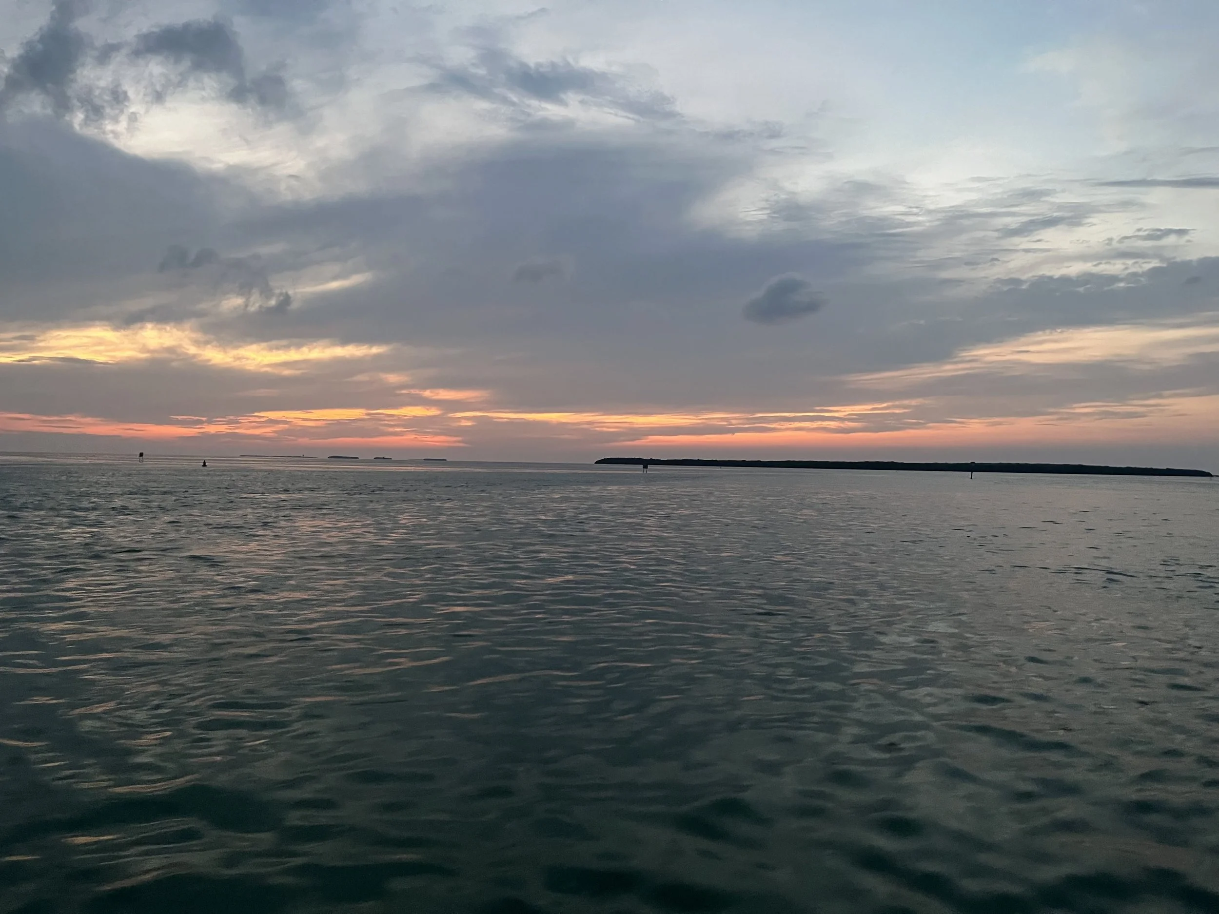 Breathtaking. Sun setting over the open ocean on the way out.