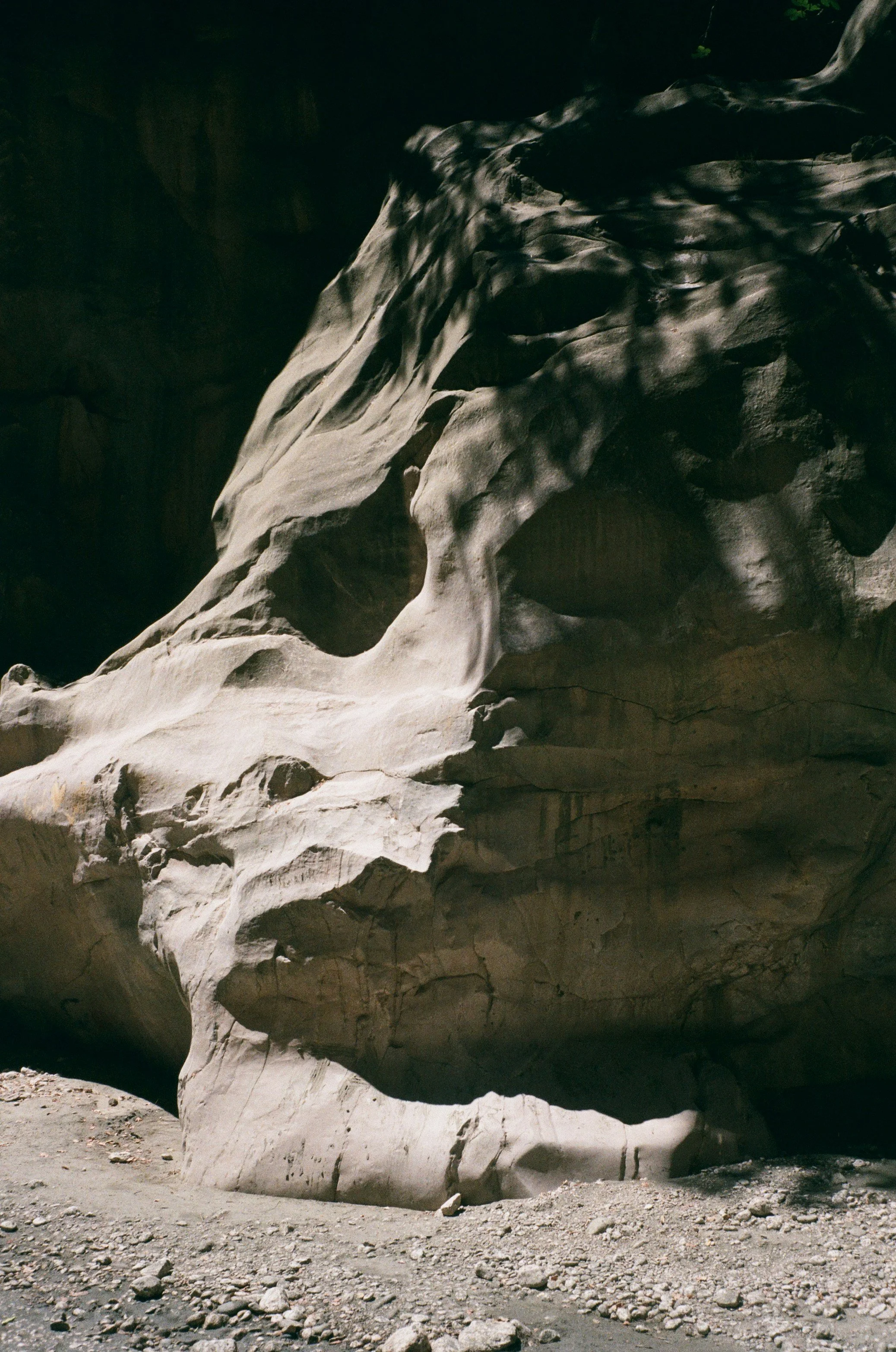 Sunlit rocky landscape symbolizing the grounded, mission-driven foundation of boutique therapy suites in San Antonio.