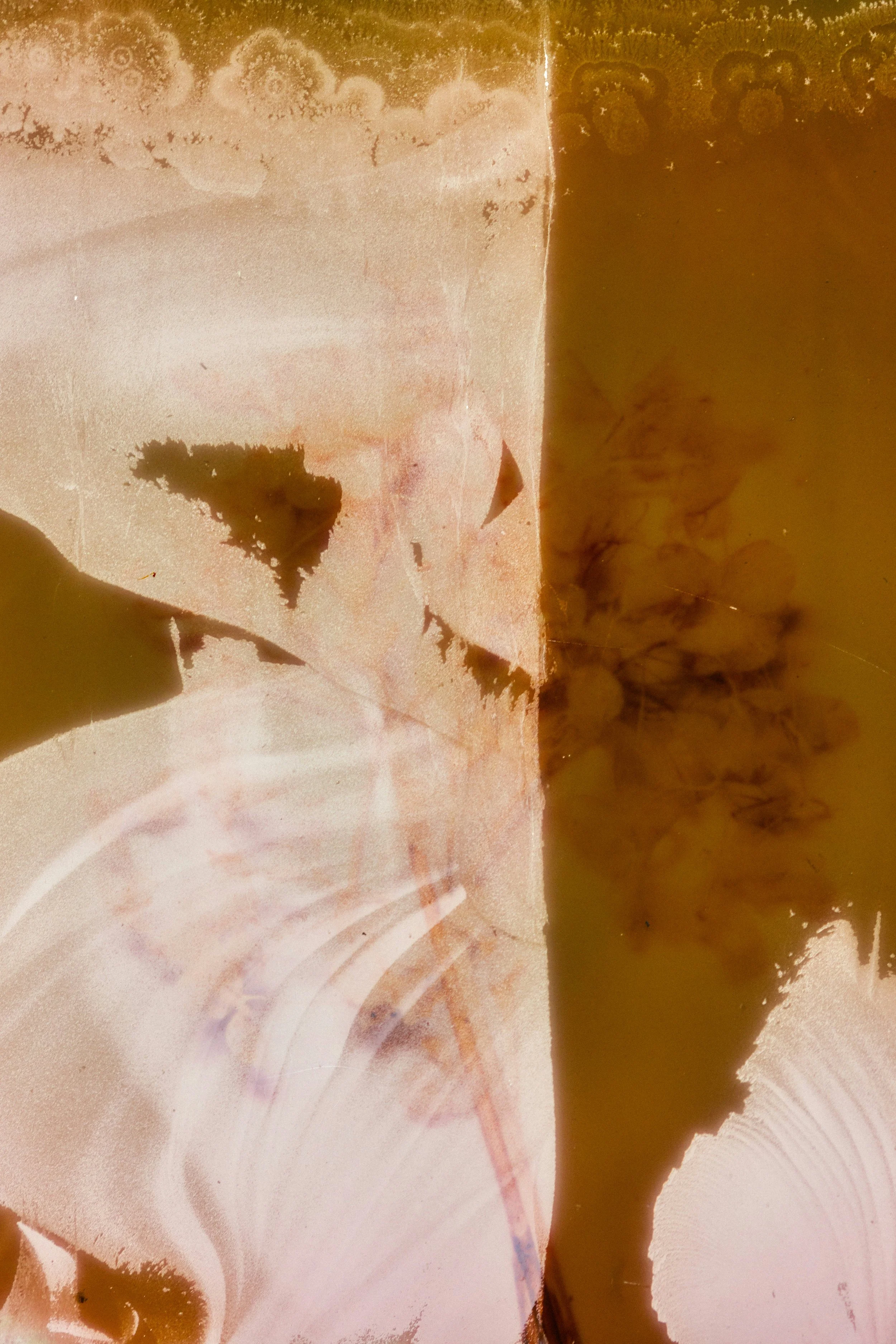 Neutral stone and water ripple textures representing the calm, intentional foundation of Luzia Therapy Suites.