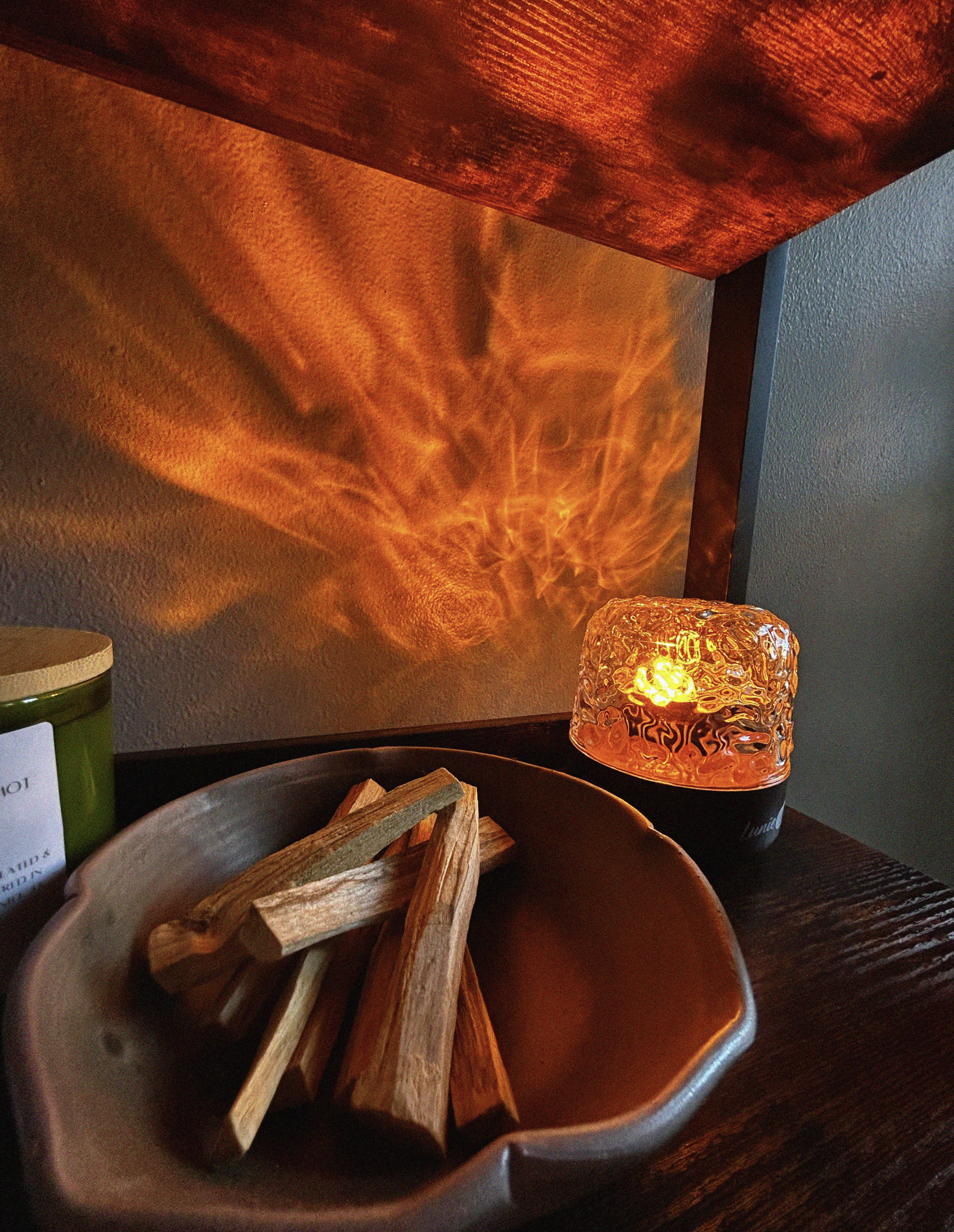 Suite C at Luzia Therapy Suites in San Antonio featuring warm ambient lighting and a calming healing environment with palo santo.