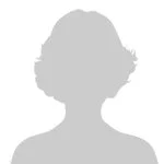 Silhouetted profile of a person with short hair facing right.
