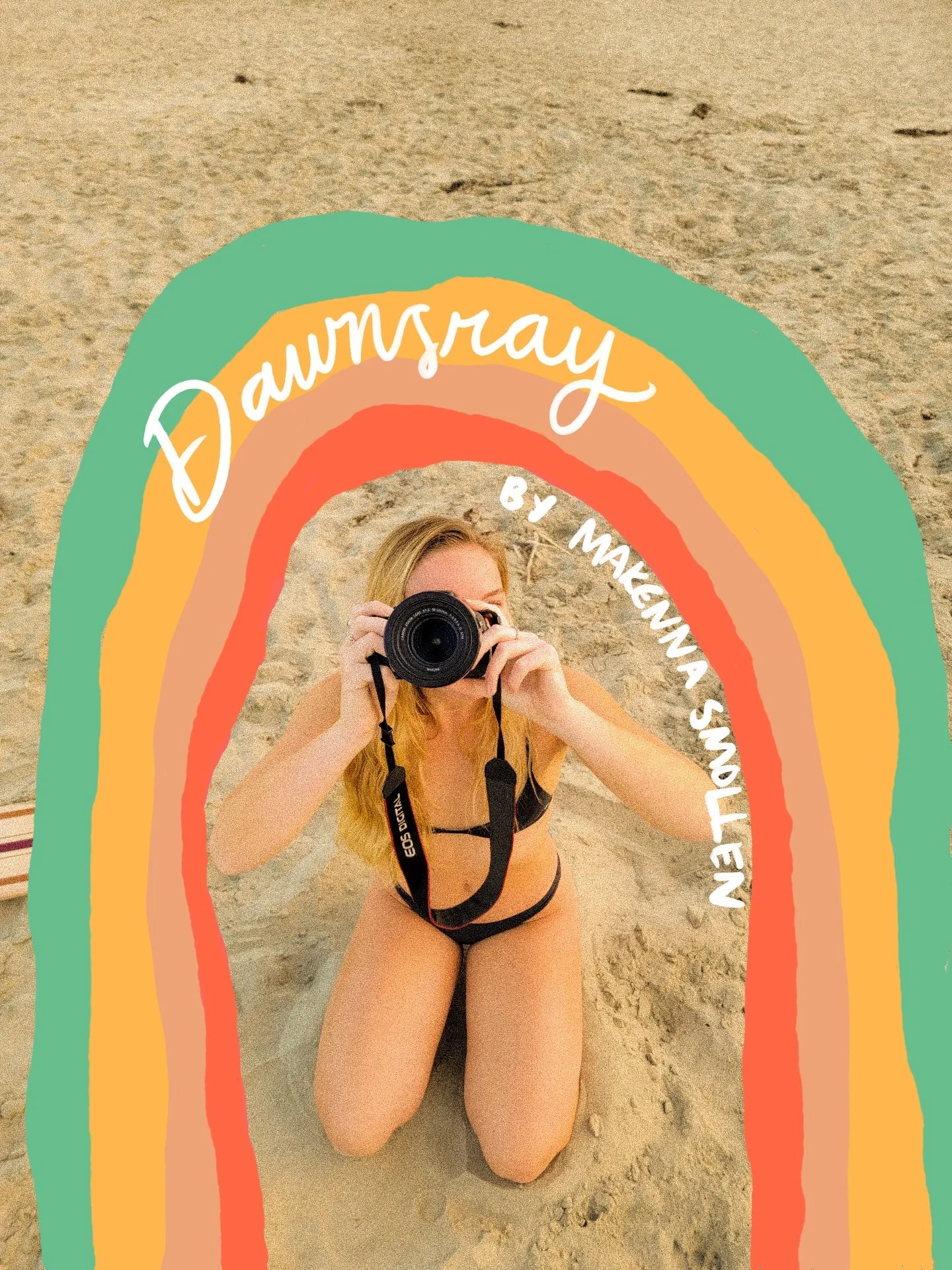 Person kneeling on the sand at the beach, holding a camera to their face, with colorful rainbow-like drawings and text overlay reading 'Dawnsray by Mackinna Snyllen'.