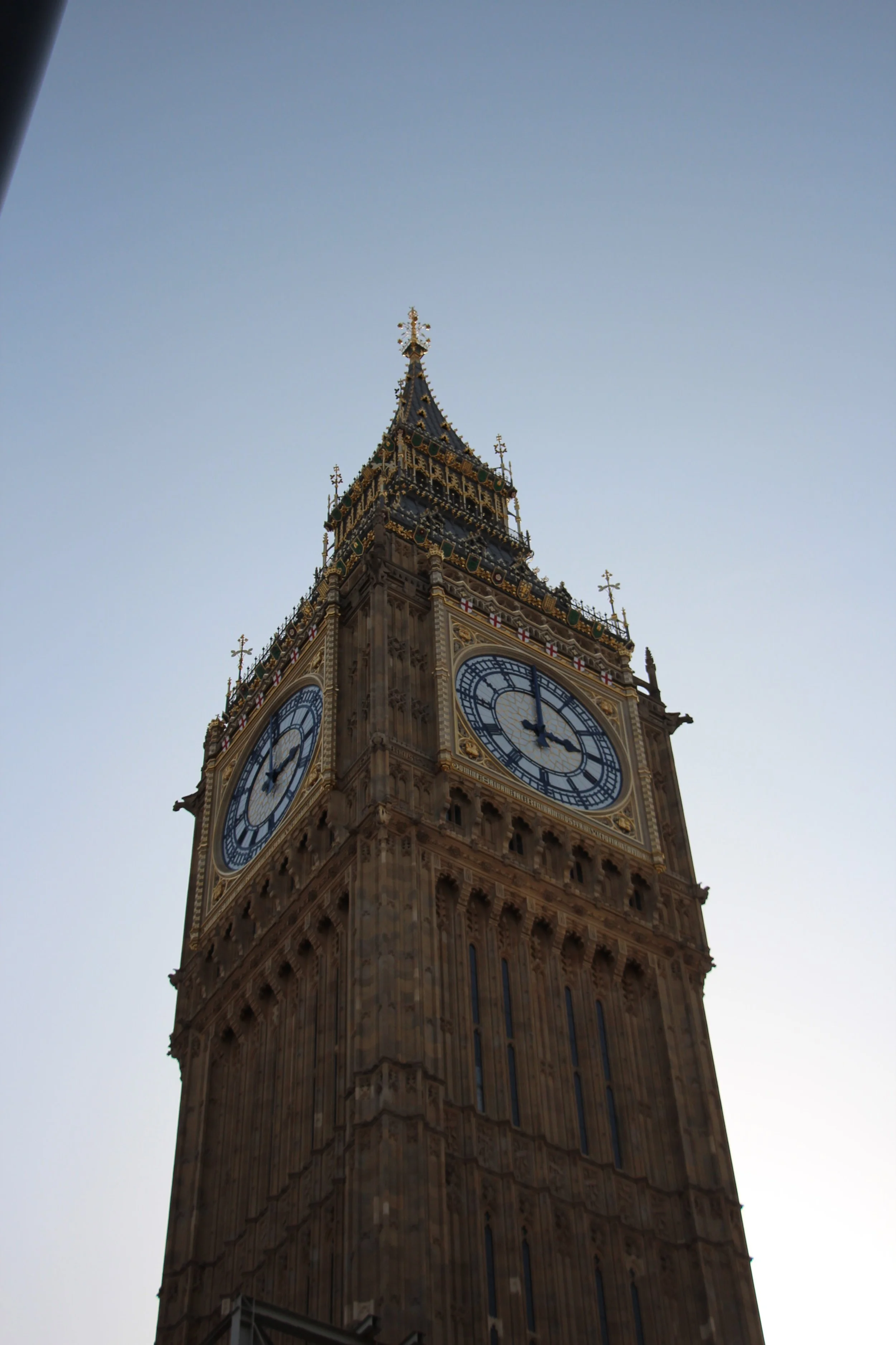 The iconic clock tower, known as Big Ben, in London against a clear sky.