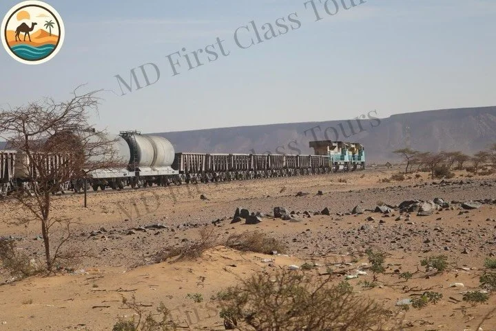 Riding the famous iron ore train in Mauritania is a once-in-a-lifetime adventure. Stretching over 700 km through the Sahara, it&rsquo;s one of the longest trains in the world, carrying iron ore from Zou&eacute;rat to the coast. Travelers who climb ab