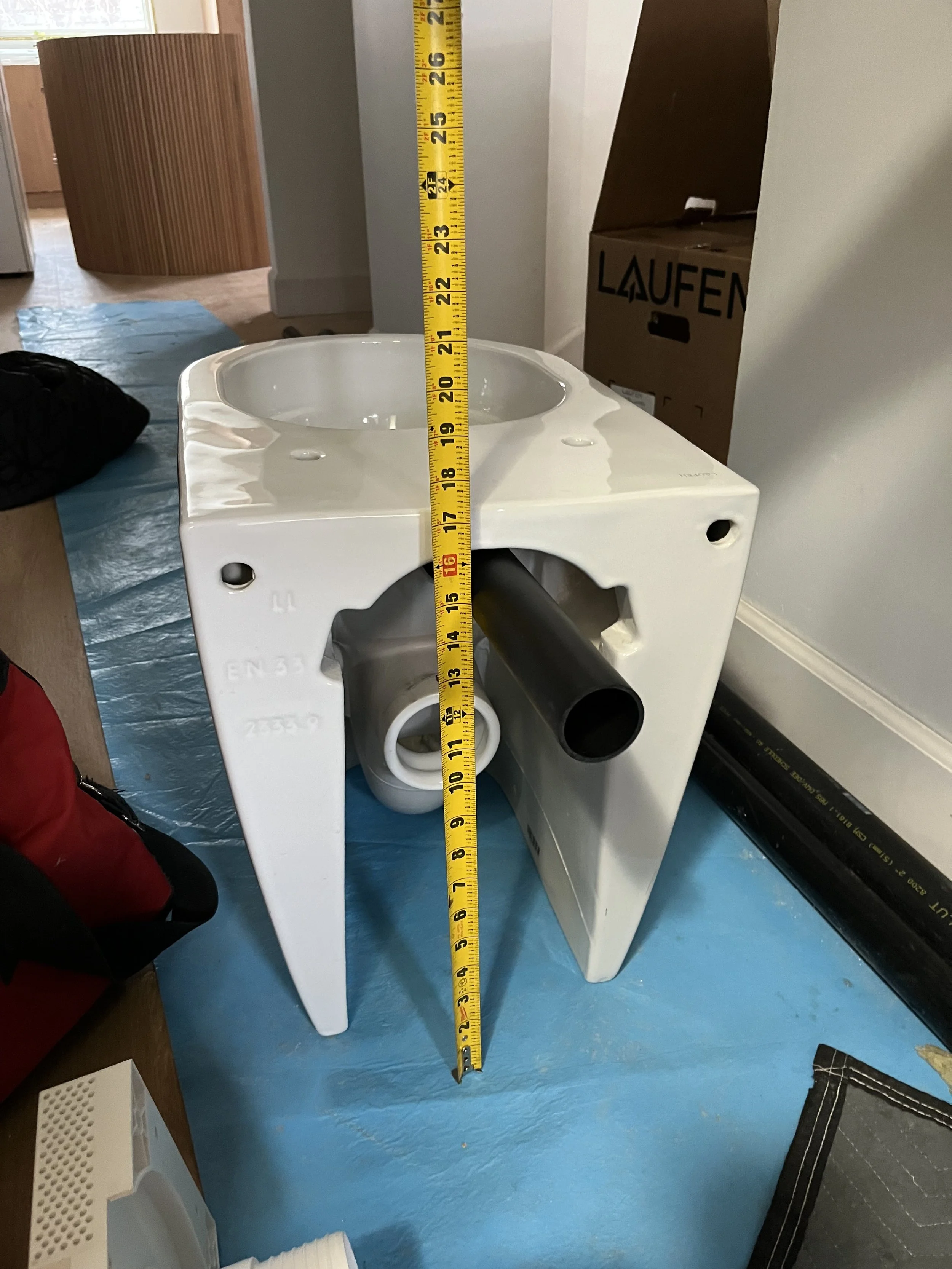 Measuring the tankless toilet for proper alignment