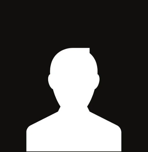 Black silhouette of a person's head and shoulders on a white background.