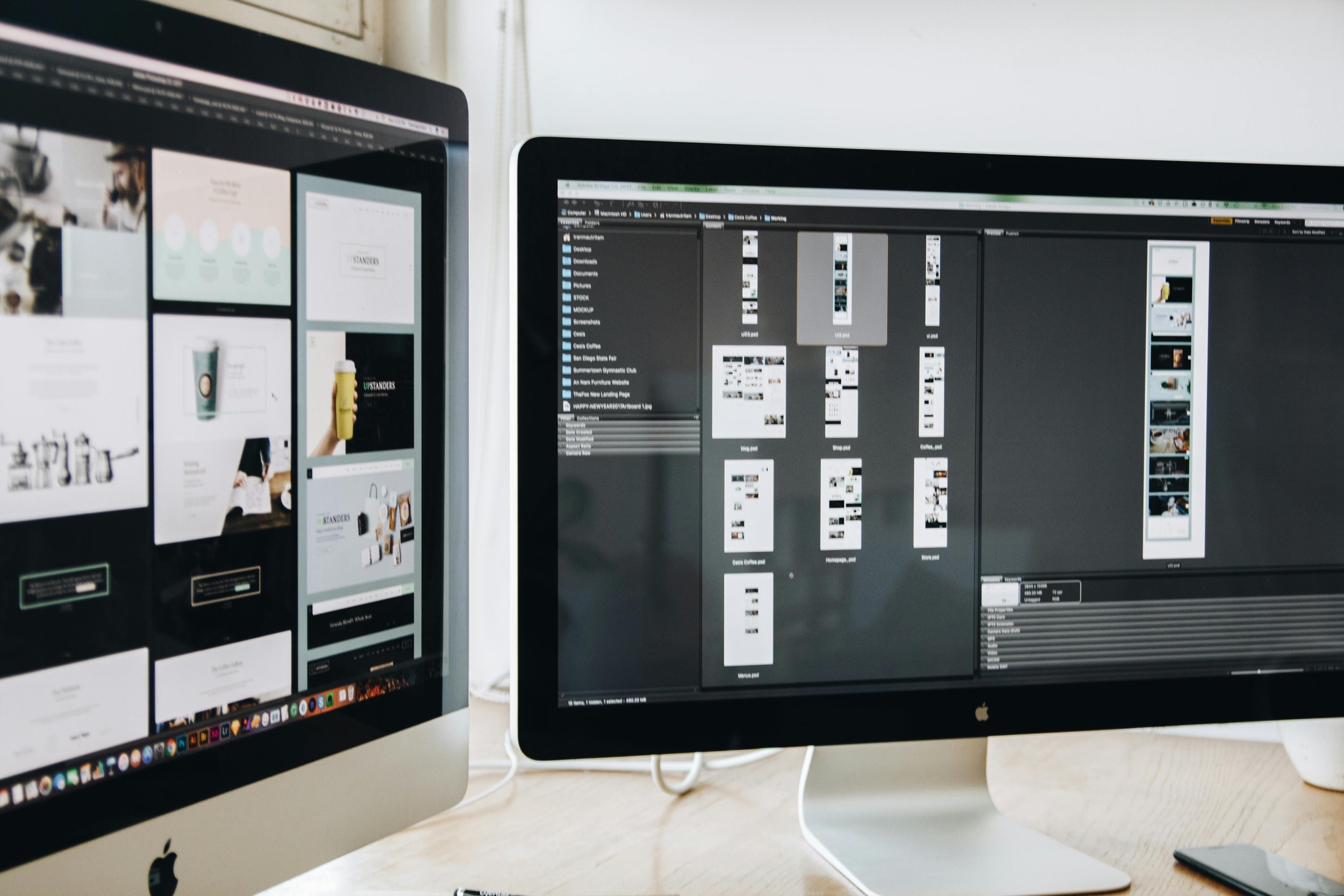 Two computer monitors on a desk, displaying photo editing and social media management software.