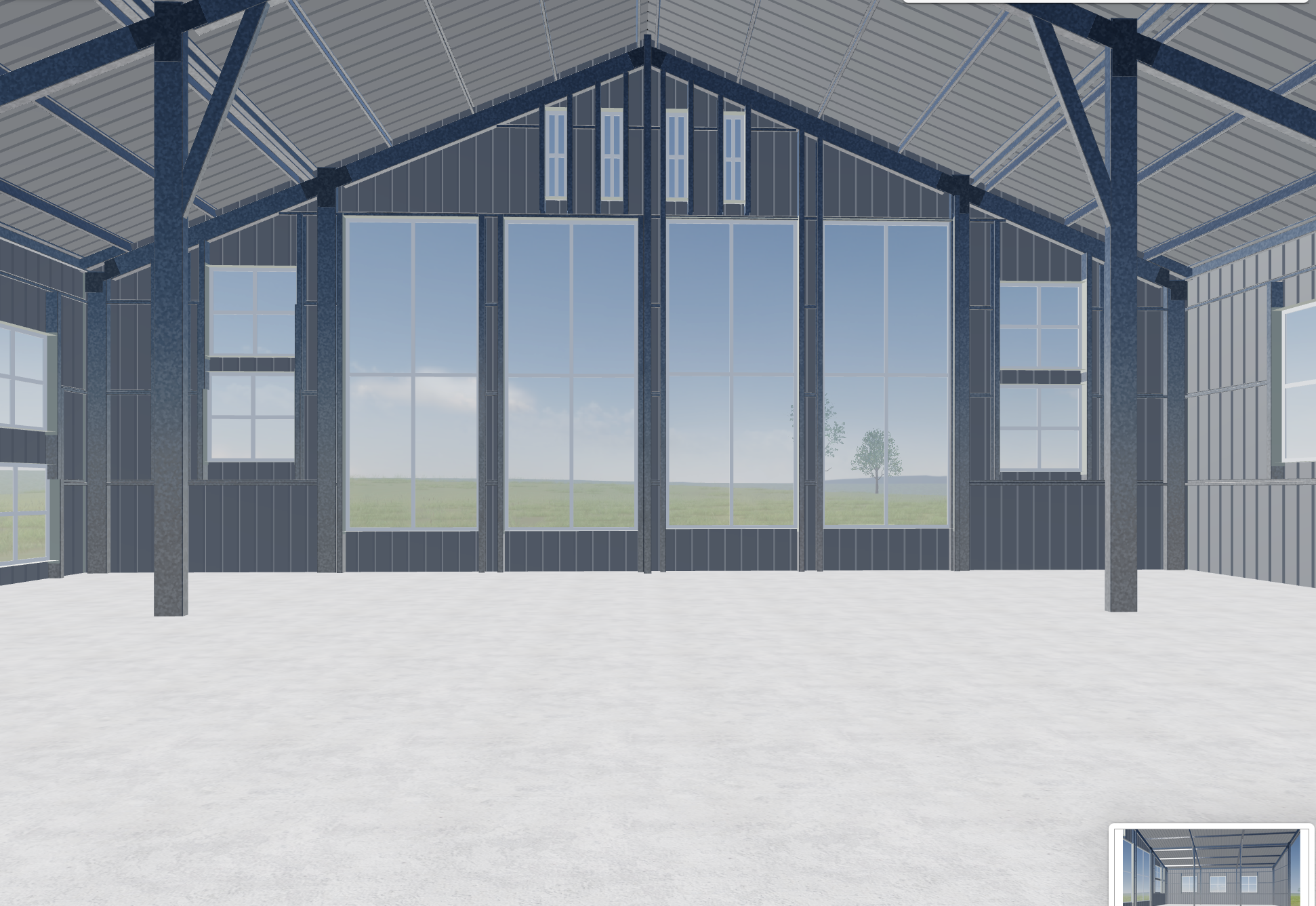 Interior view of a metal building with large windows, showing an open space with a concrete floor and a view of green fields and trees outside.