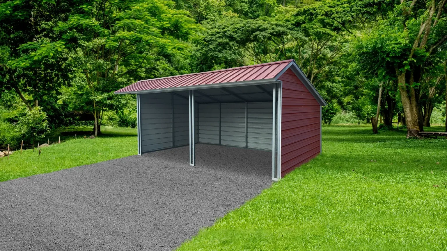 Metal carport with red roof and gray sides on a gravel driveway in a lush green backyard.