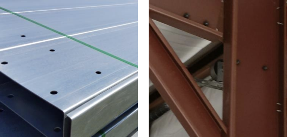 Close-up of a metallic flat surface with drill holes and a green line, next to a red metal frame structure with screws.