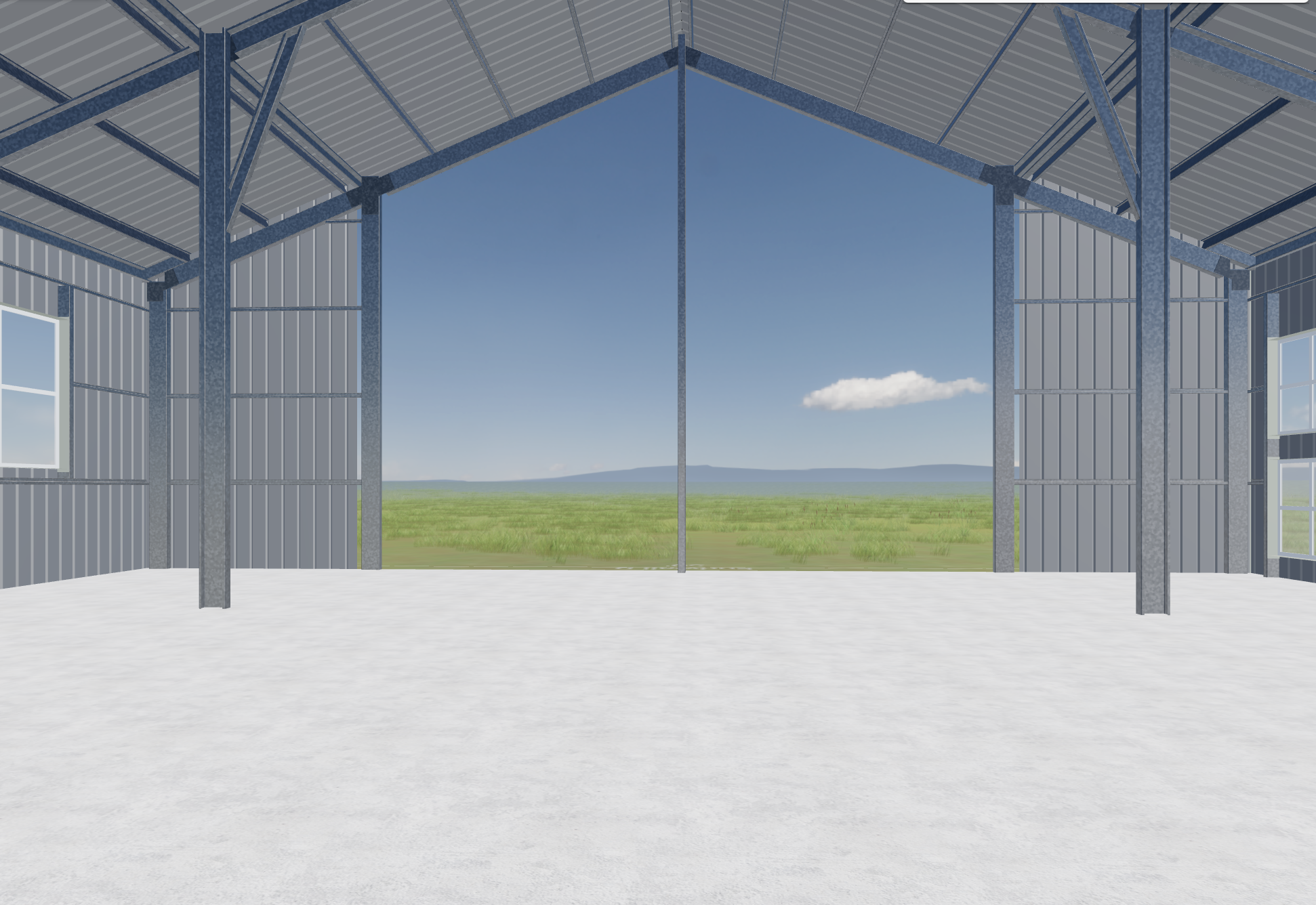 Interior of a metal building under construction with open sides, showing a concrete floor, steel beams, and a view of green fields and blue sky outside.