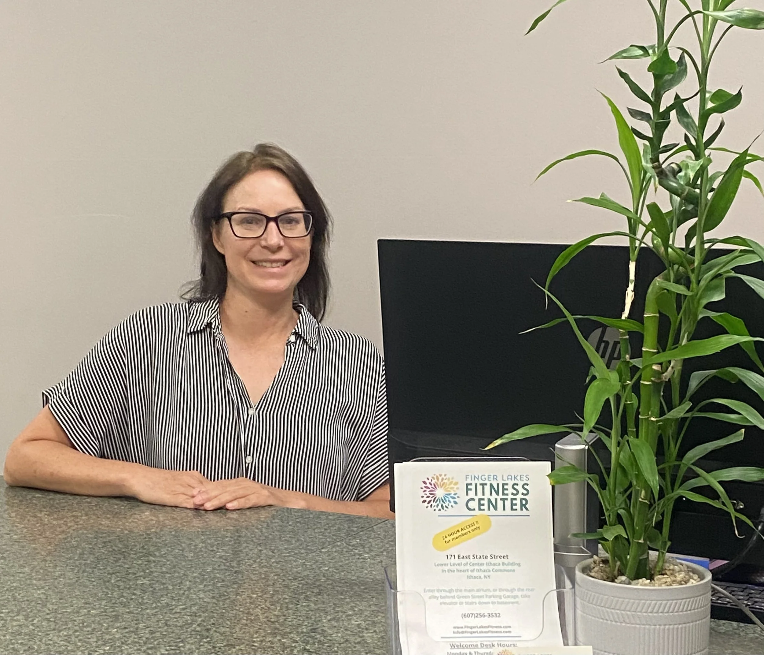 Woman behind Welcome Desk