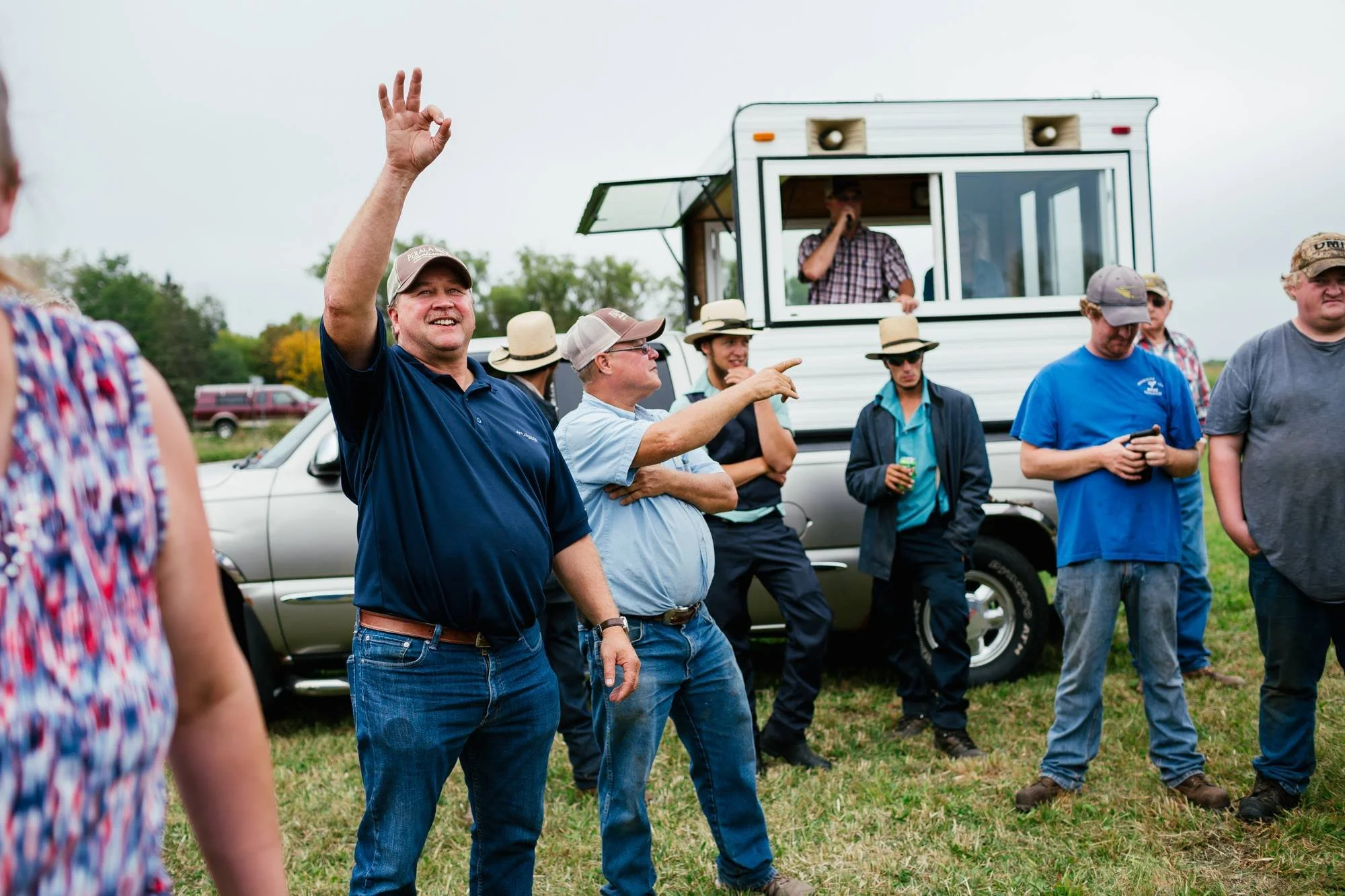 Auctiooneer and ringman at an outdoor auction