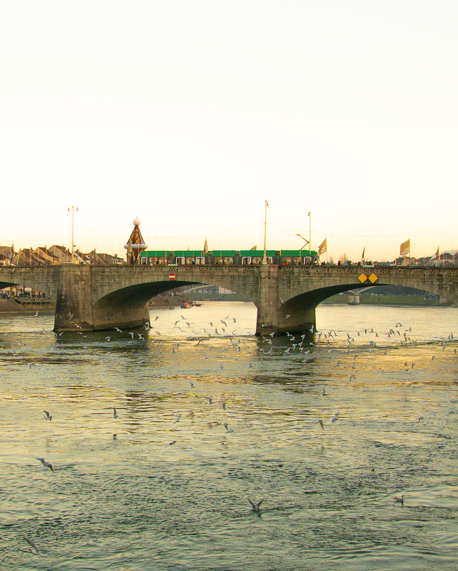 Originally, this was an anamorphic image showing a section of the bridge in Basel with warm Christmas lights and seagulls flying around.