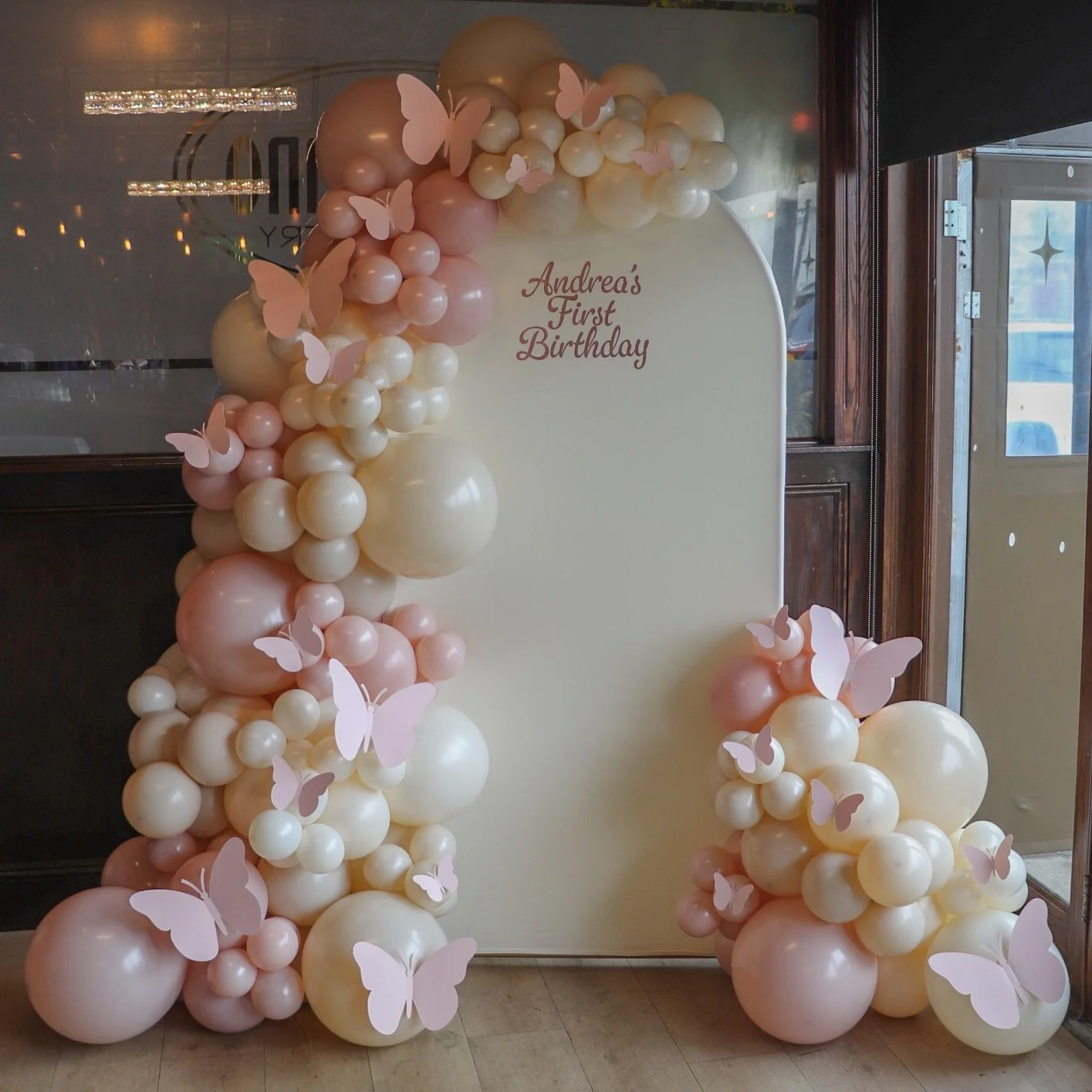 Andrea&rsquo;s first birthday ✨🩷 these butterflies really made this arch everything🥰