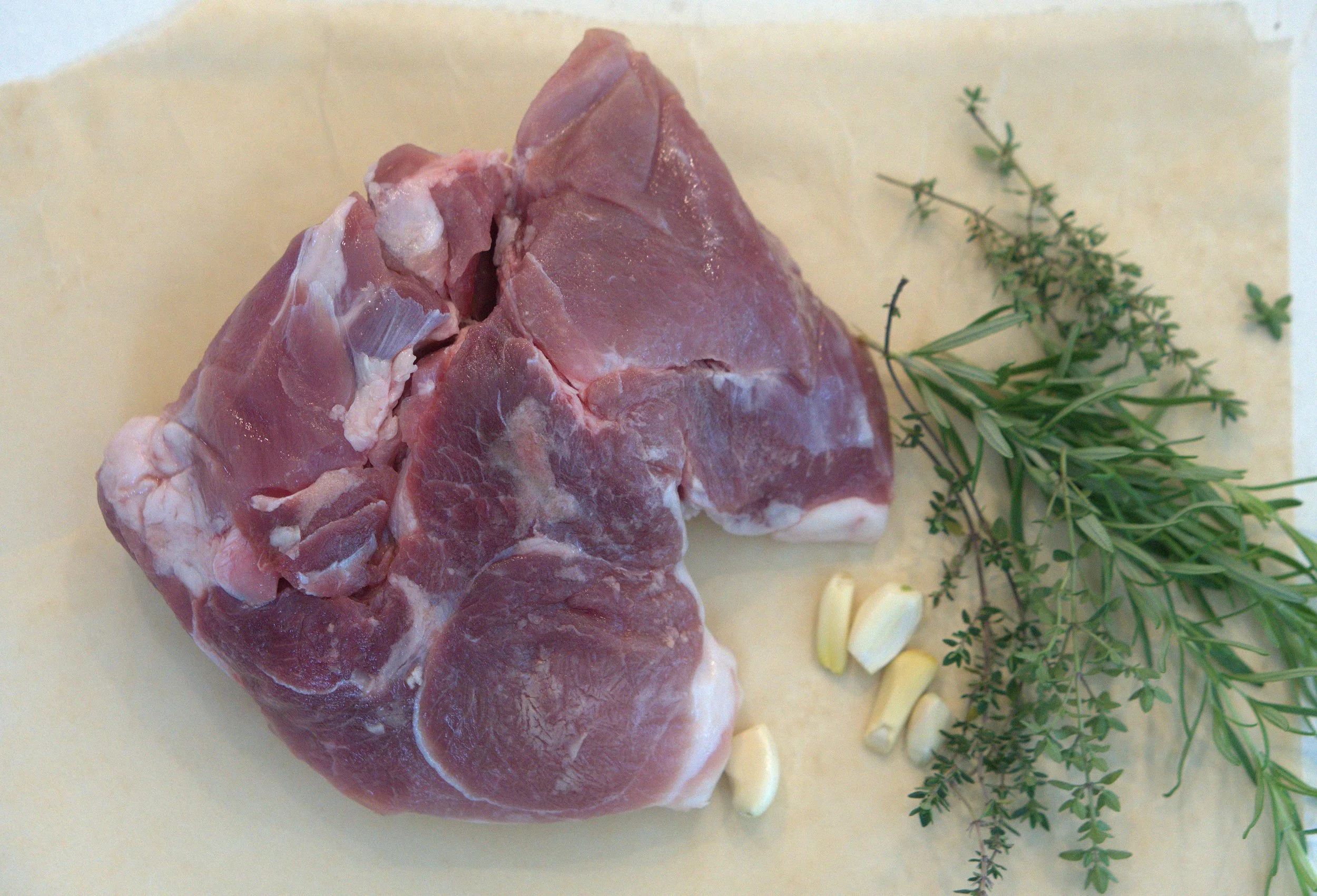 Fresh ham roast with garlic and herbs