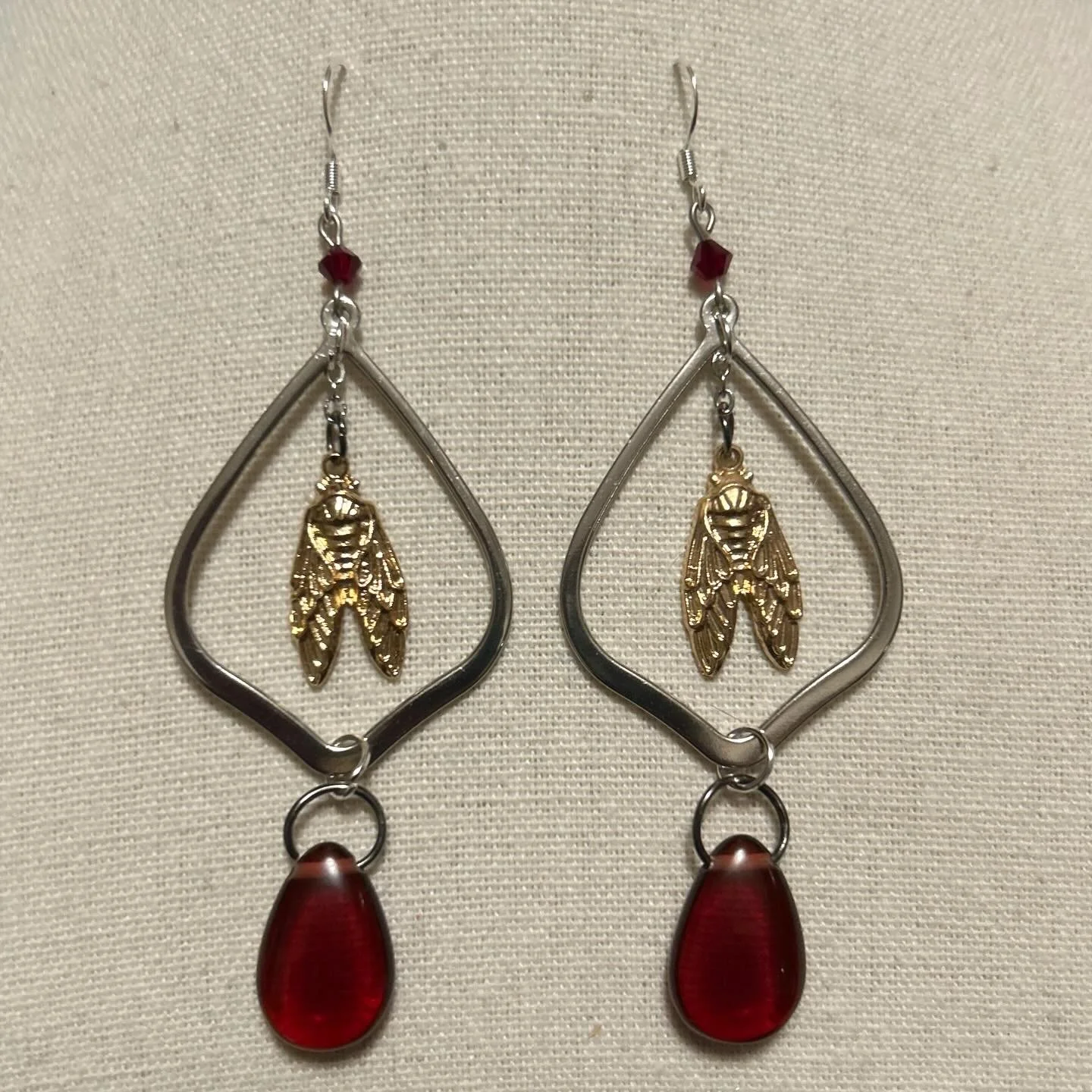 Cicada charms with upcycled beads and silver findings.