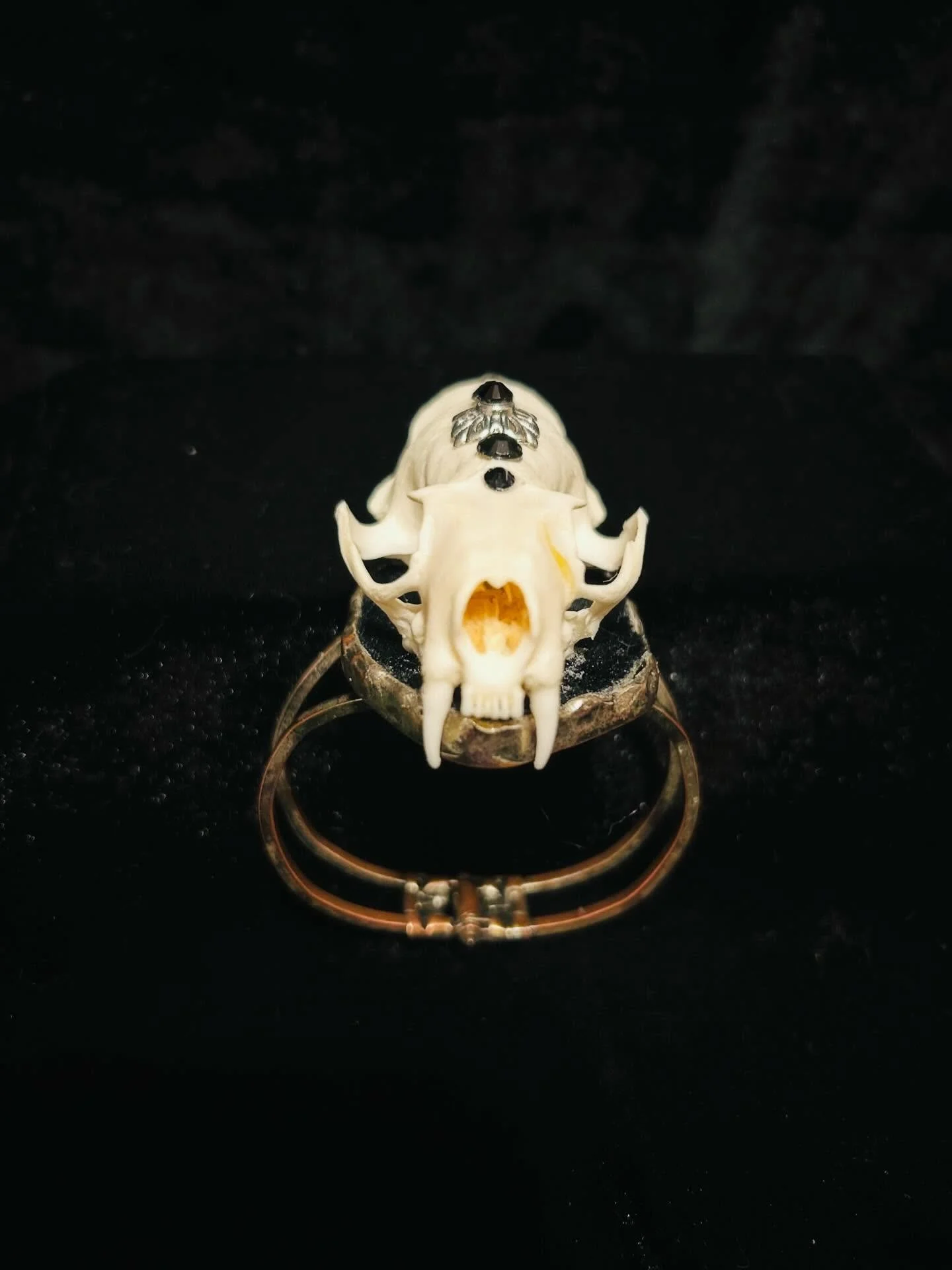 Mink skull on upcycled bracelet base with black rhinestones.