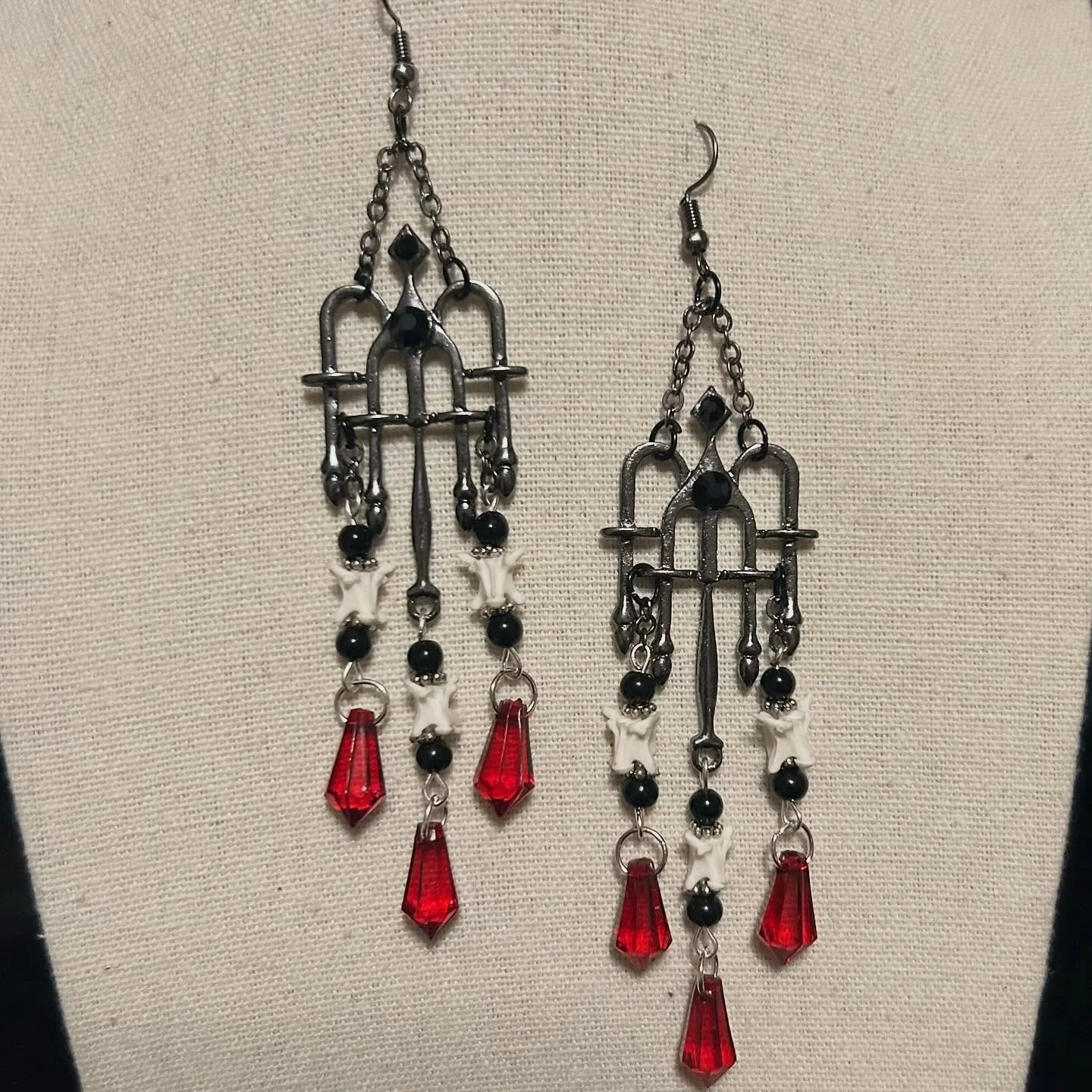 Snake vertebrae with upcycled beads and findings.