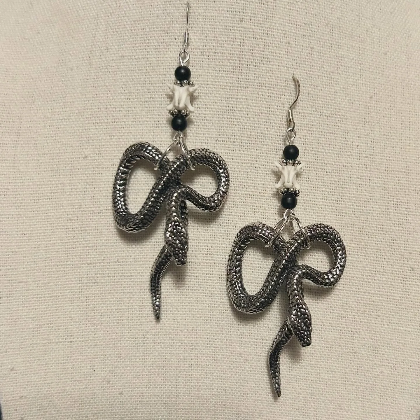 Snake pendants with vertebrae and upcycled beads.