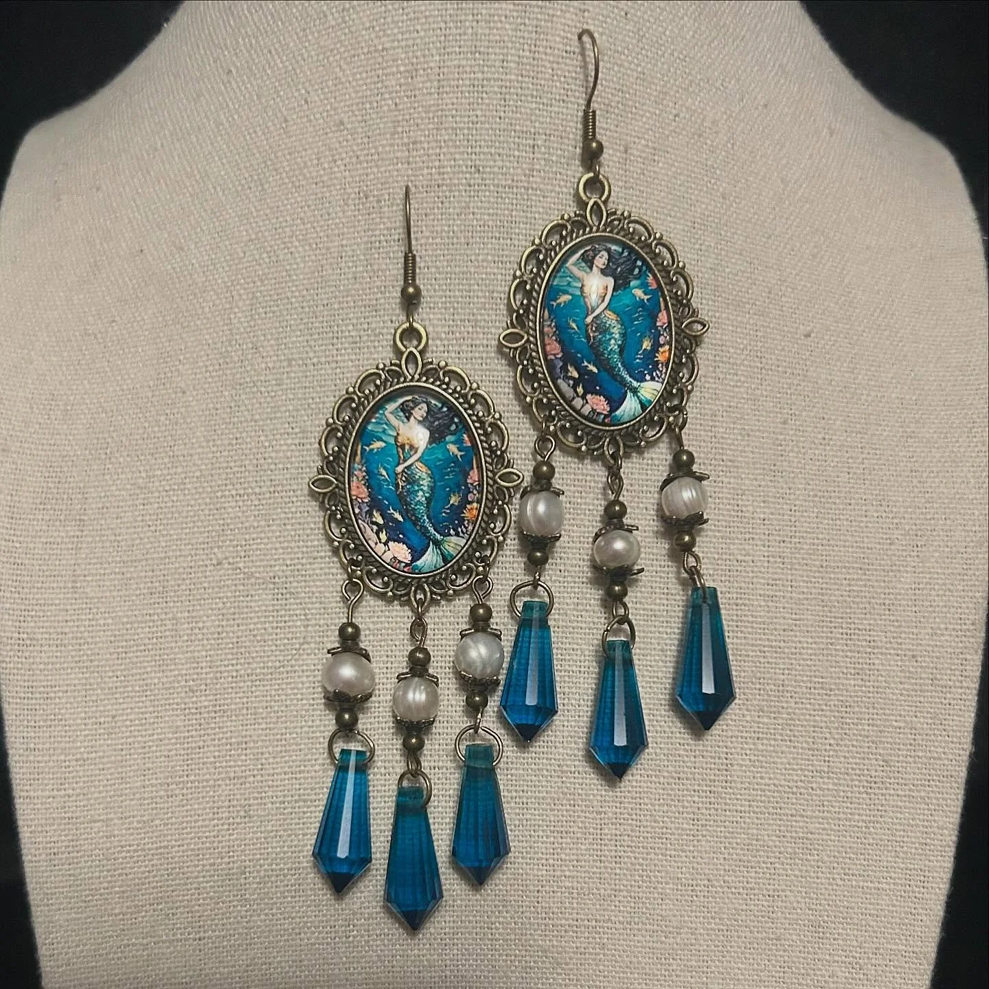 Mermaid cabochons with fresh water pearls and brass findings.