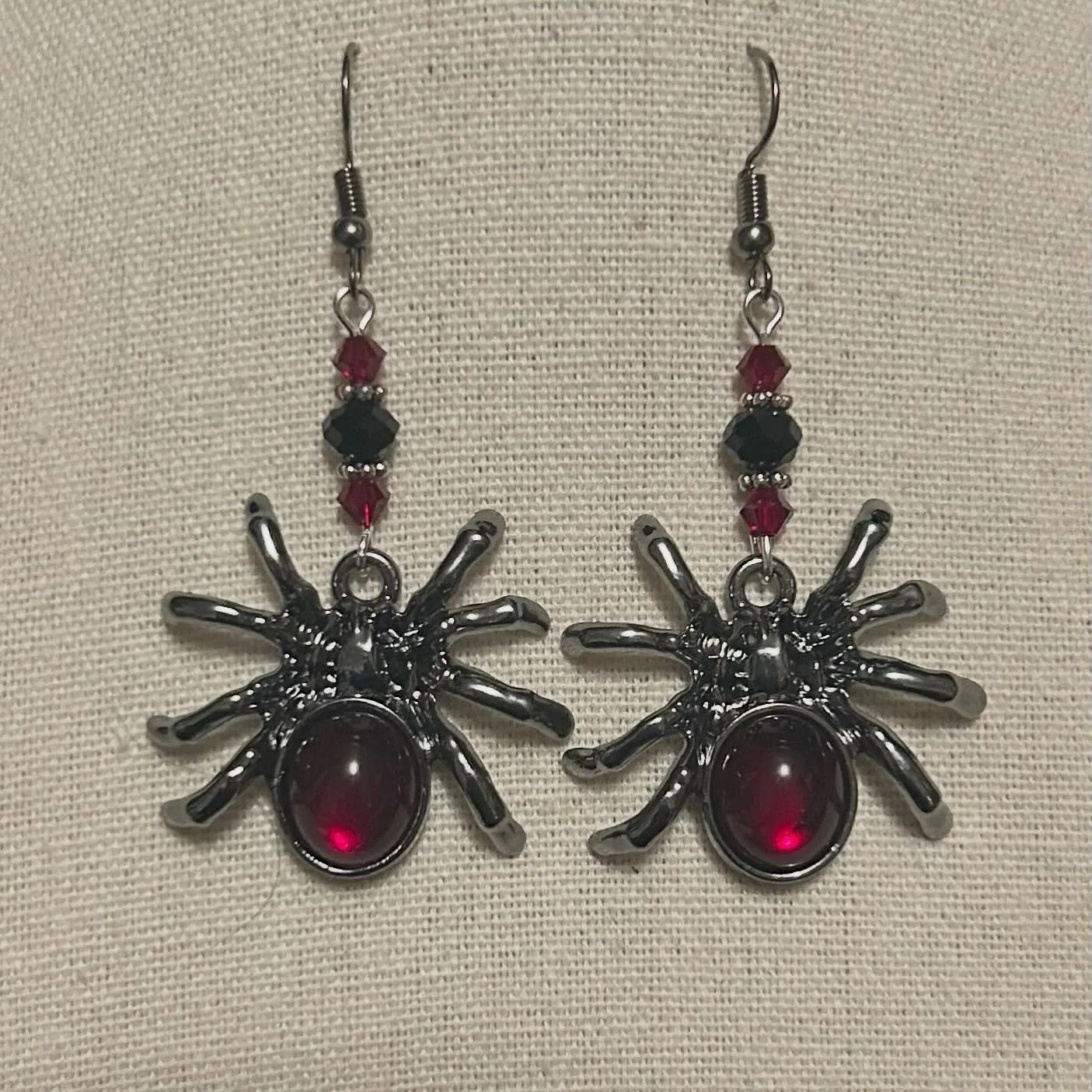 Spider pendants with upcycled black and red glass beads.