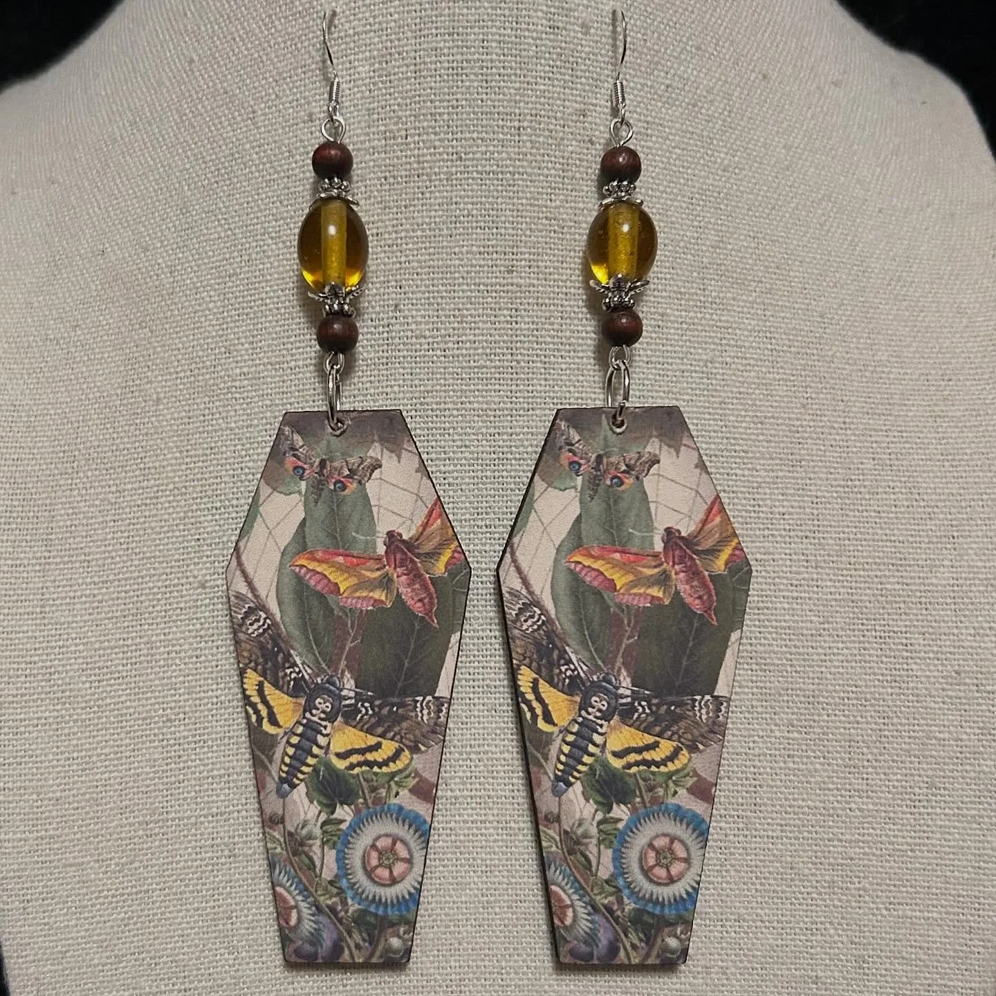 Moth woodcuts with upcycled wood and glass beads