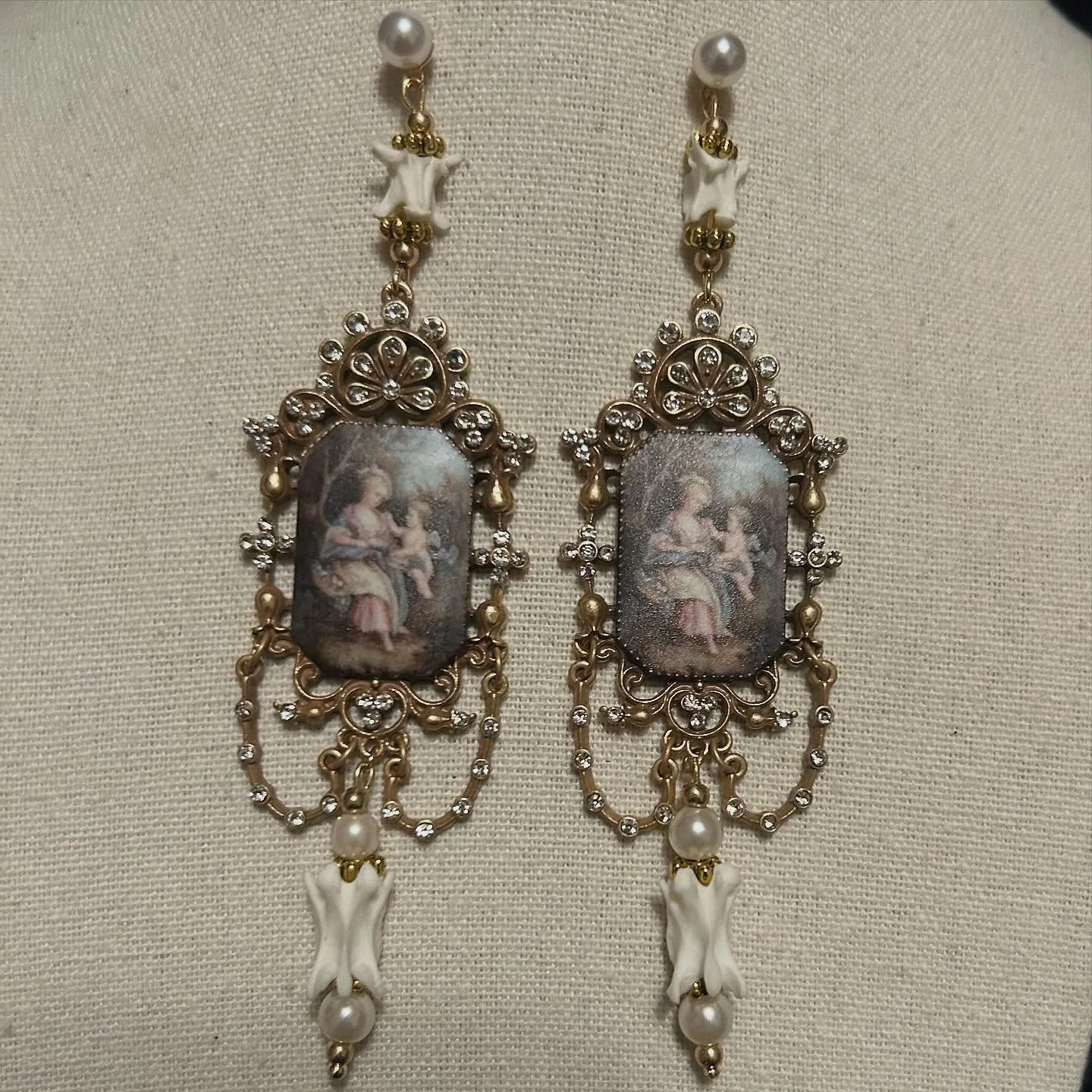 Rococo styled pendants with snake and mink vertebrae combined with faux pearls.