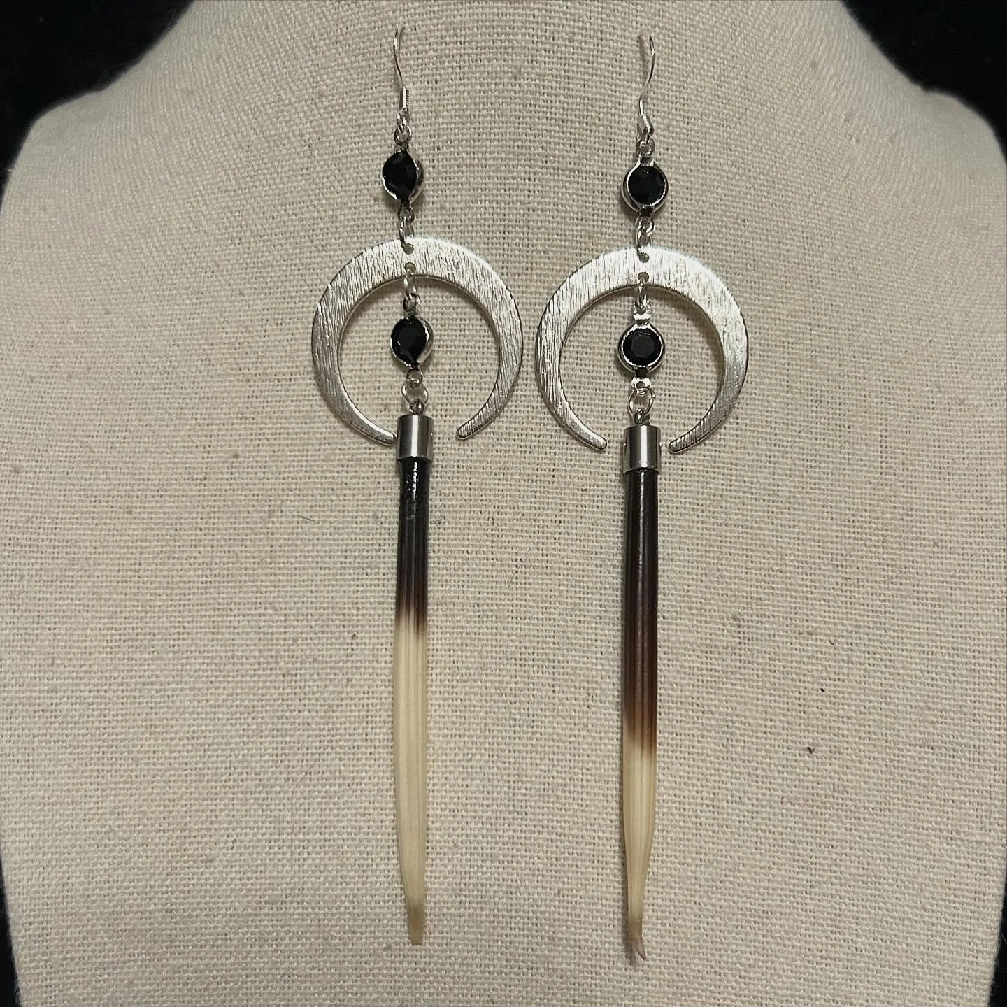 Silver crescent moons with African porcupine quills with upcycled black beads.