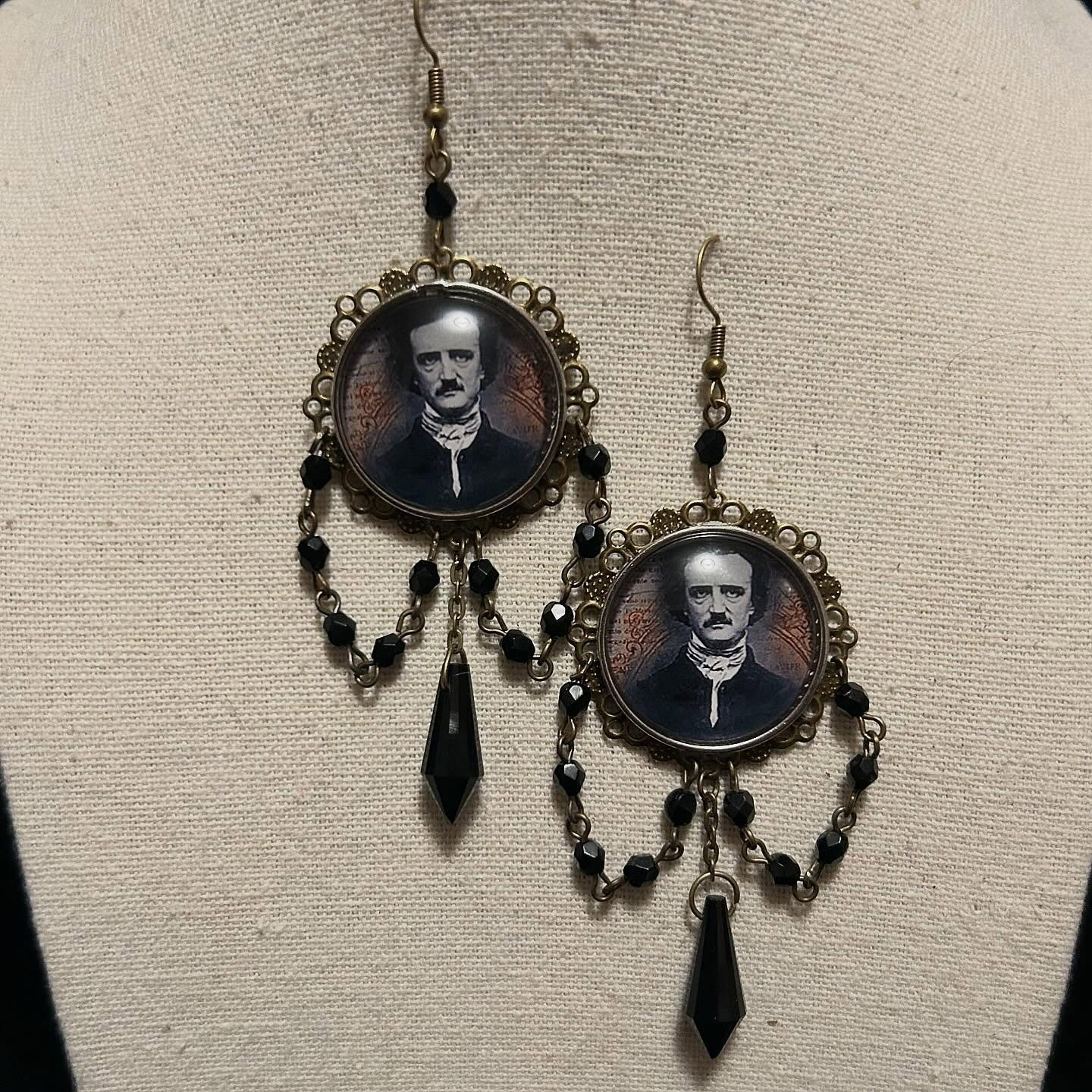 Serving Edgar Allen Poe Momento Mori realness! Poe cabochon featuring black glass beads and pendant with brass findings.