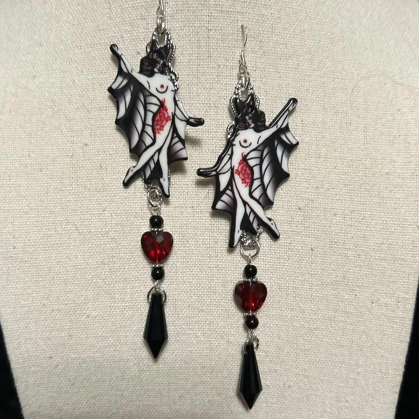 Cute tattooed bat ladies with red crystal hearts and black glass pendants