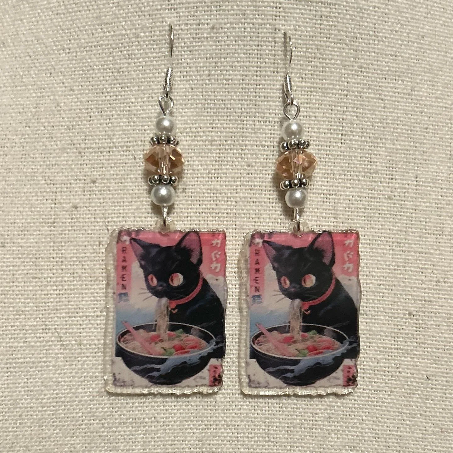Noodle loving kitty pendant with pink glass beads and faux pearls.