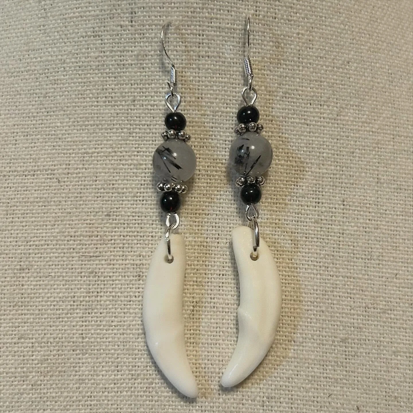 Rutilated quartz and Coyote fangs.