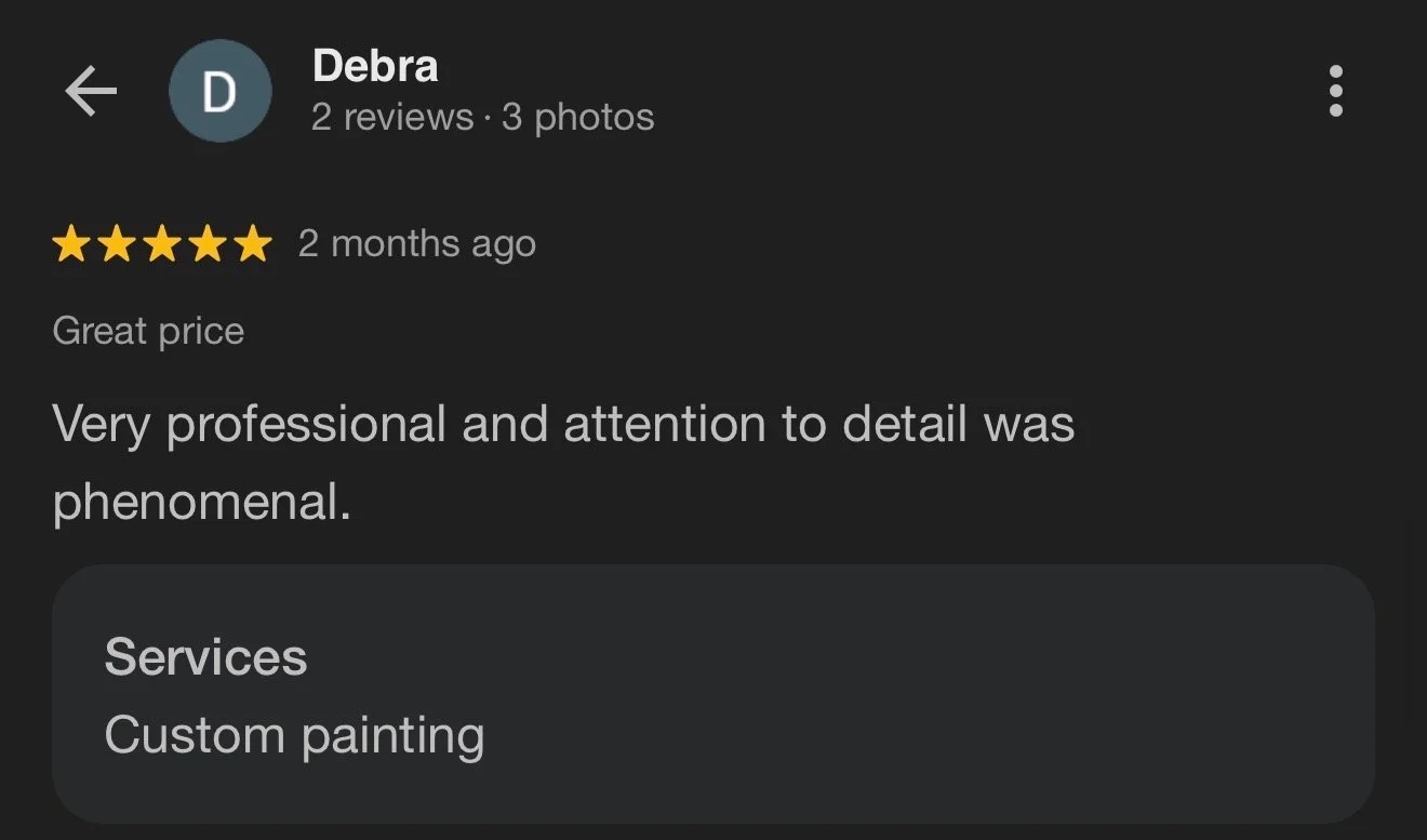 Screenshot of a Google review for a custom painting service, showing the reviewer Debra giving five stars and a comment praising the professionalism and attention to detail.