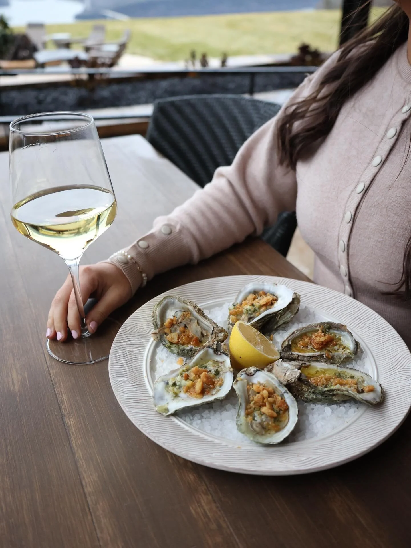 Best enjoyed with a glass of white wine on the patio.

The perfect pairing: broiled oysters and a glass of white wine on the patio.

Lemon, scampi butter, shallots, and Parmesan combine for a dish that shines when paired with a slow evening outdoors.