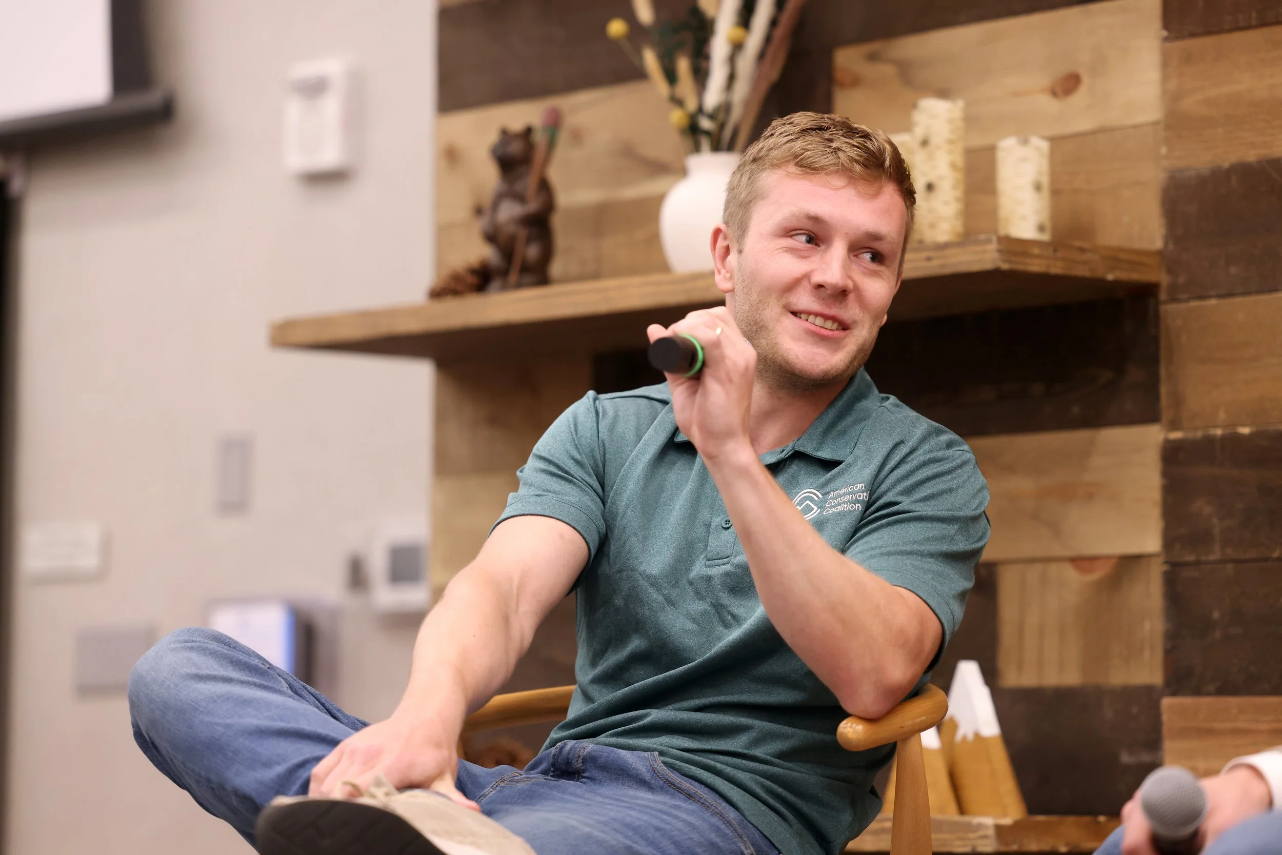 American Conservation Coalition (ACC) President Chris Barnard addresses other panelists onstage at an ACC event.