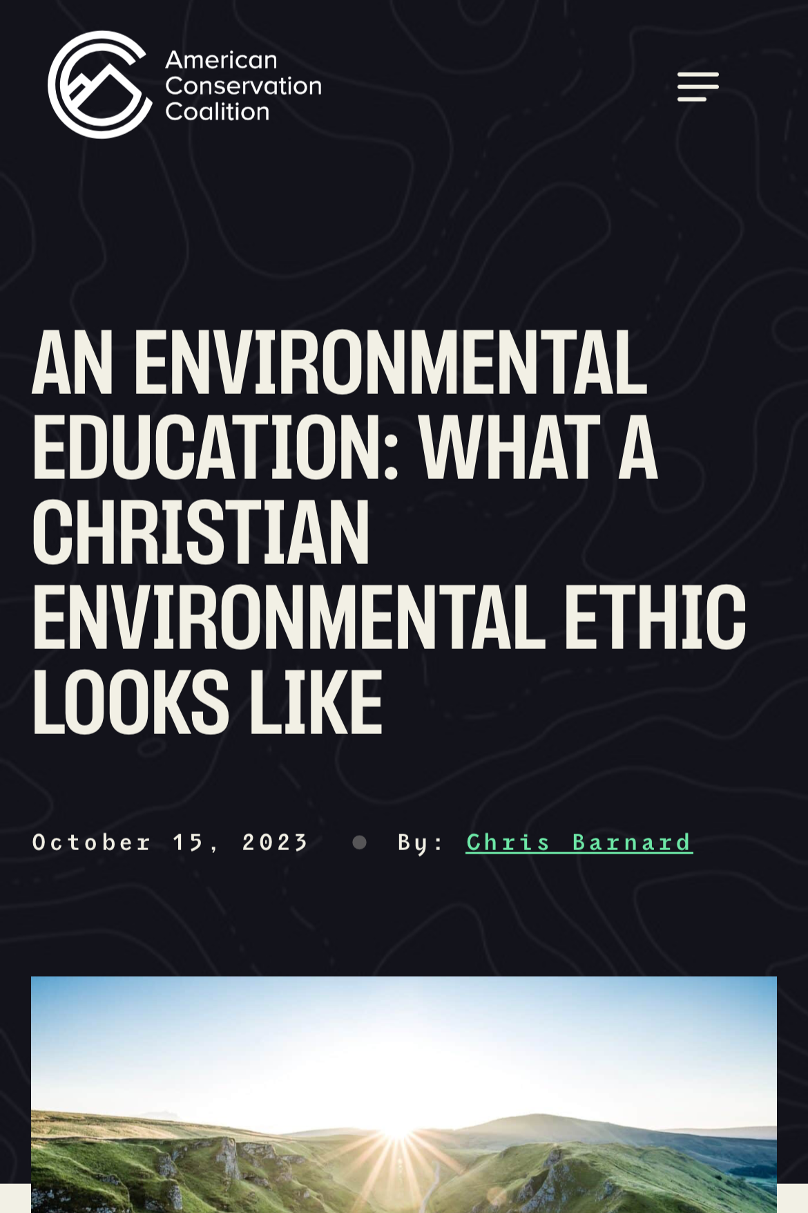 Green hillside landscape with a winding road, under a bright sunrise or sunset sky.