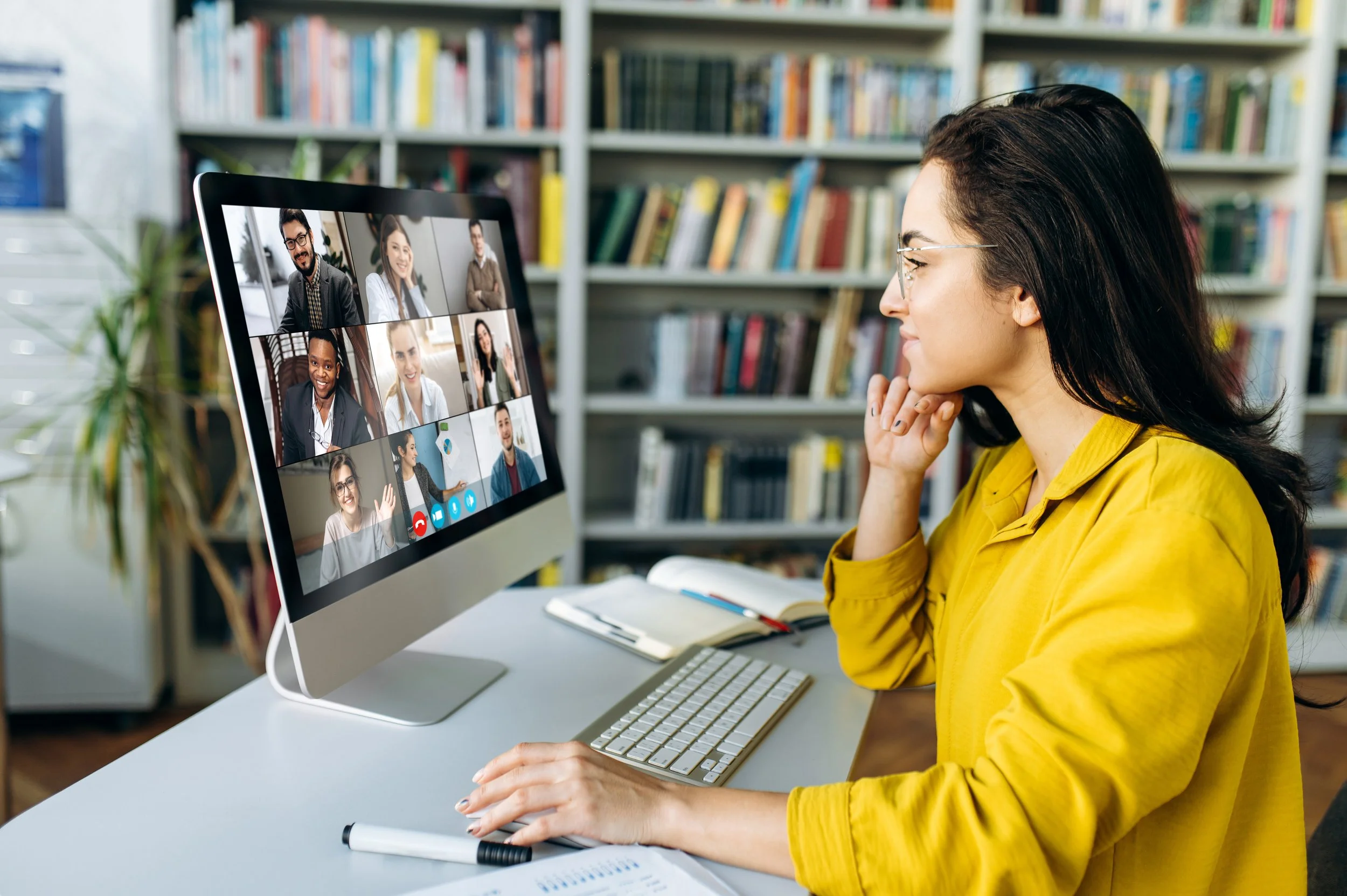 Person on computer participating in a virtual meeting