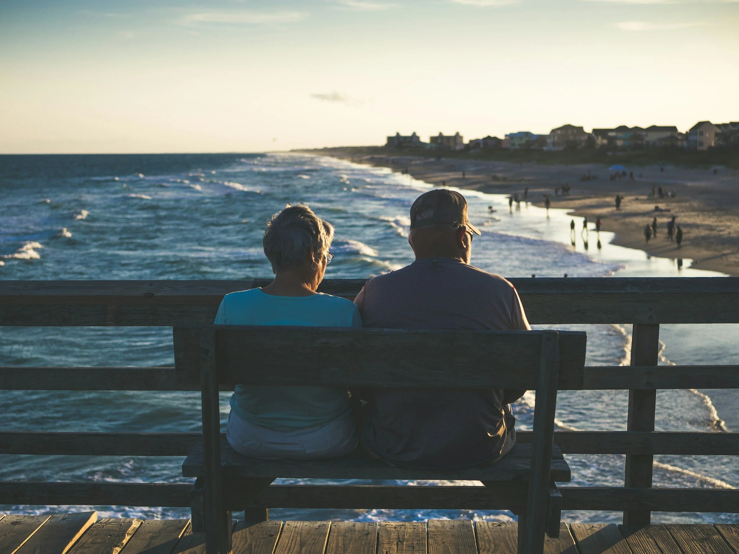 Retired couple overlooking the ocean symbolizing financial peace of mind through sustainable income planning in Maryland.