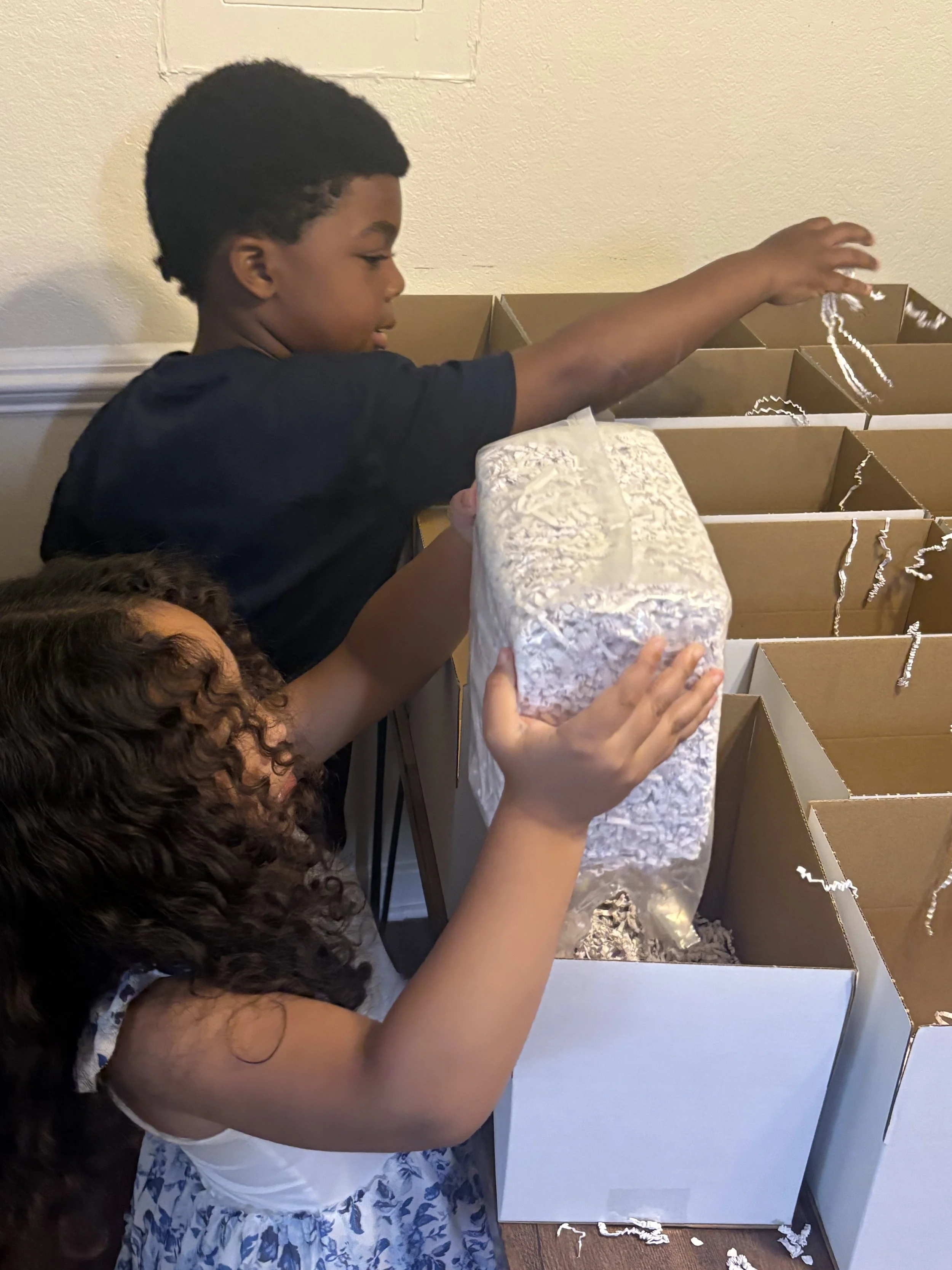 Children Help Pack Boxes