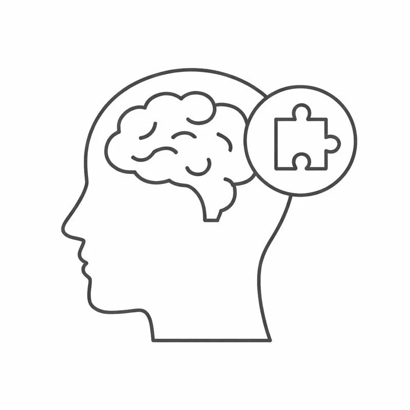 Outline of a human head with a brain and a puzzle piece inside a circle.