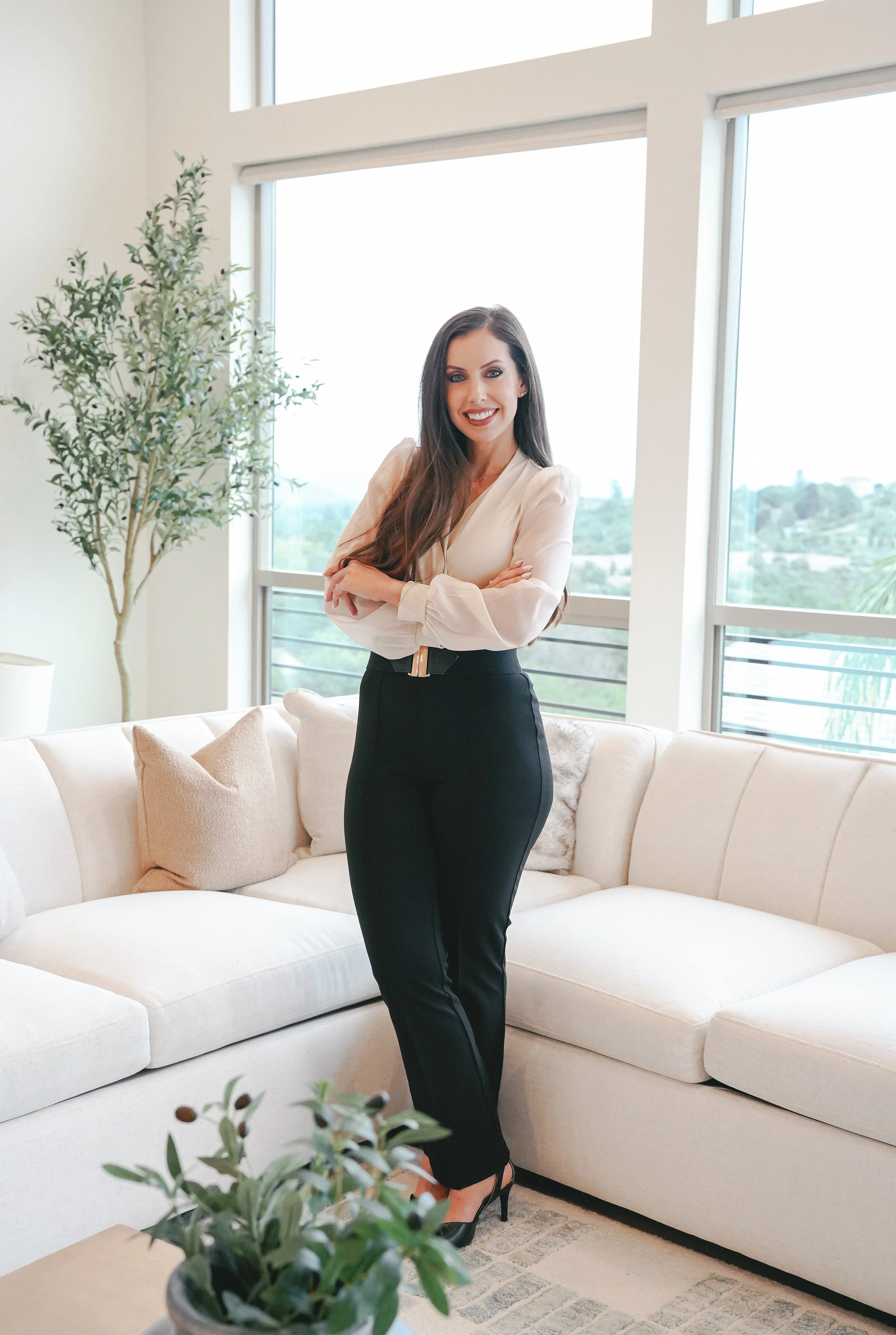 Nicole Turturici, a Folsom and El Dorado Hills REALTOR and lifestyle guide, standing in a modern luxury home