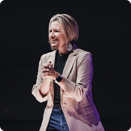 Shannon speaking from a stage