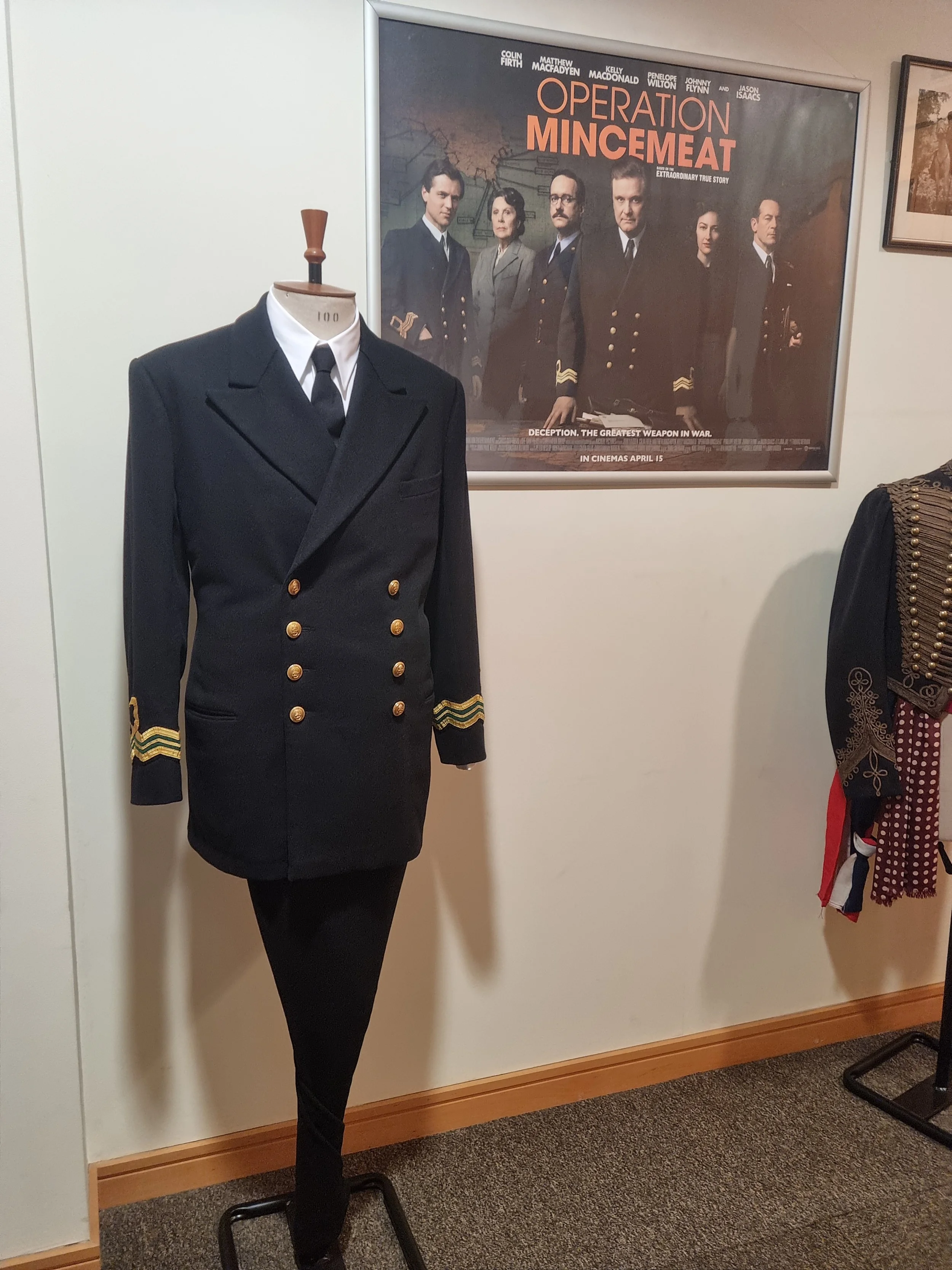 Royal Naval Reserve Intelligence cuff ranking for Colin Firth in Operation Mincement, 2021
