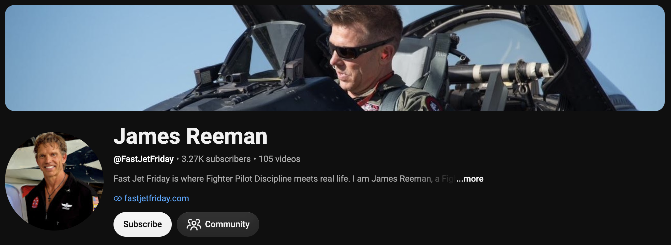 Person in a fighter jet cockpit wearing sunglasses, with a clear blue sky in the background.