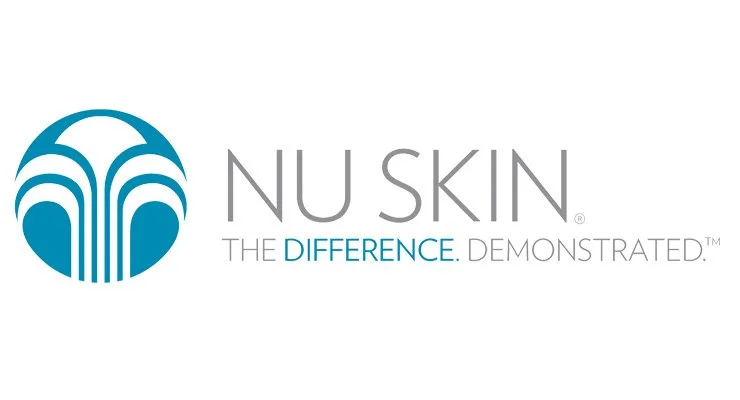 NU SKIN logo with blue and gray text and slogan 'The Difference. Demonstrated.'