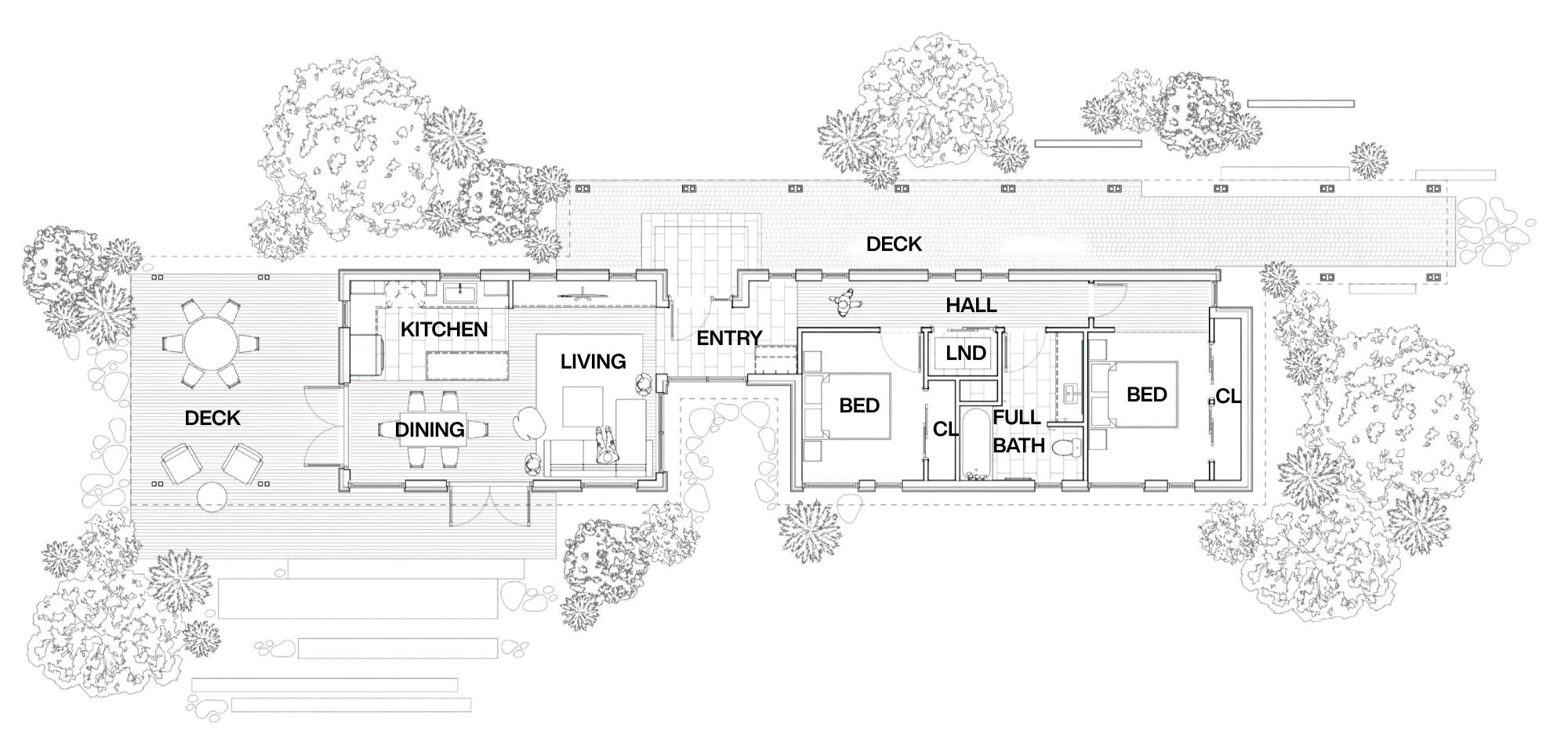 Floor plan of a house with multiple rooms, decks, and surrounding trees.