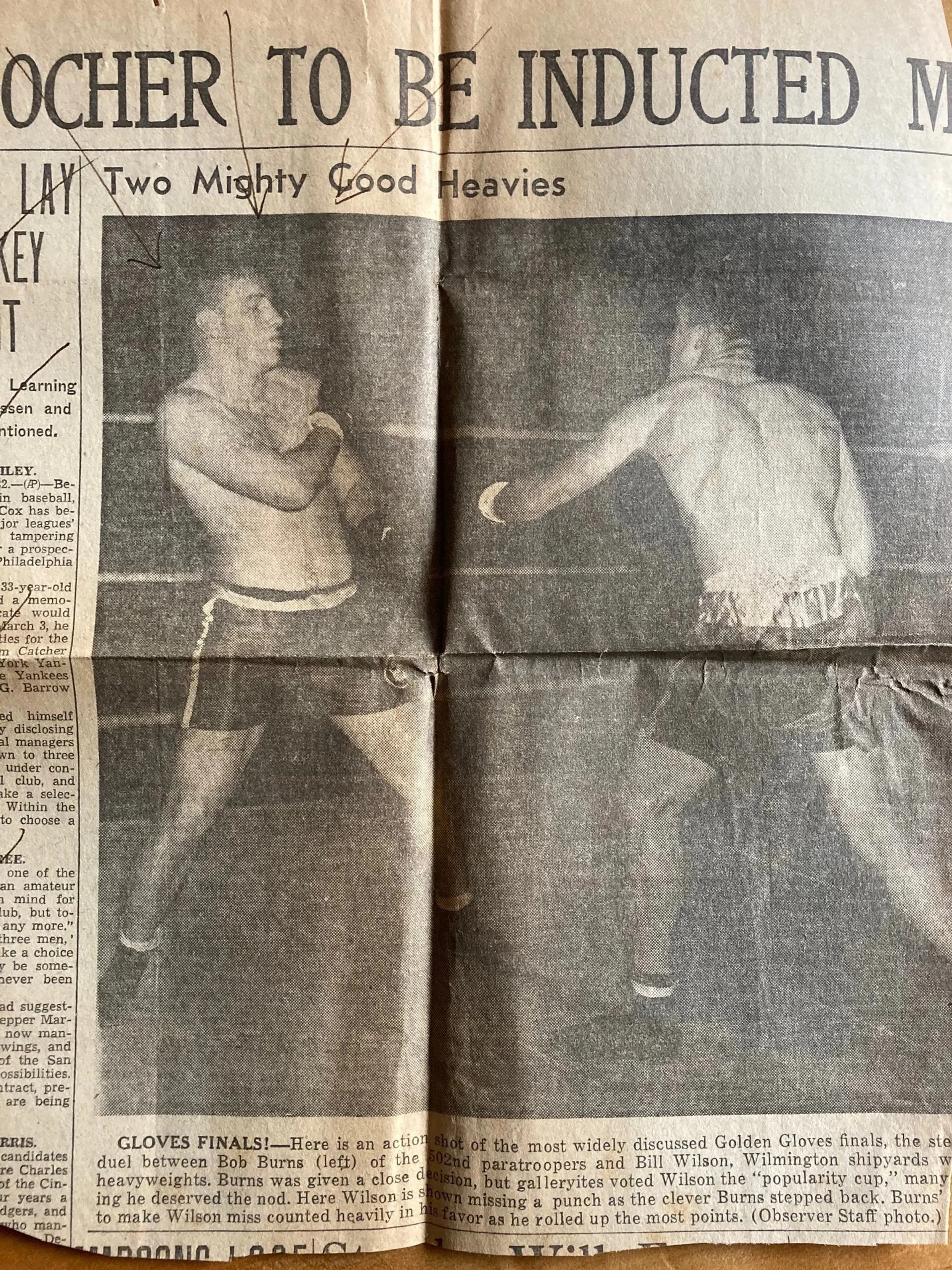 Charlotte, North Carolina newspaper article  of 101st Airborne Division athletic officer and 502nd paratrooper - - Lieutenant Bob Burns (on left) - - defeating local heavyweight Bill Wilson at the Carolinas Golden Gloves tournament in 1943. Burns sav
