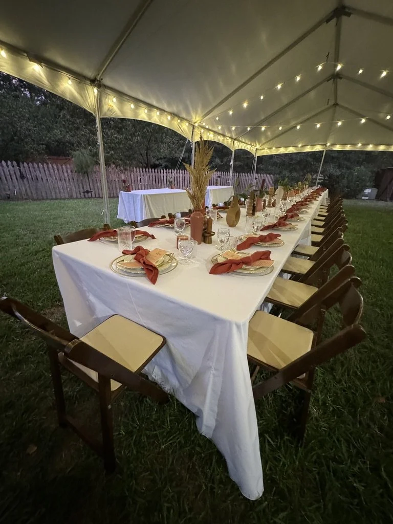 Outdoor dinner or community gathering for mission-driven organizations in Nevada – long table set under canopy with string lights, food, and table settings facilitated by ALIGN Agency