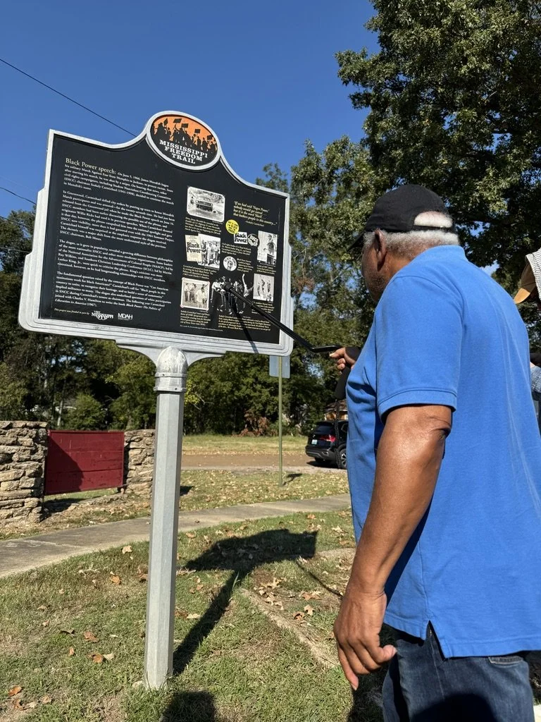 Educational outdoor learning experience during a community workshop for mission-driven organizations – participant reading Mississippi Freedom Trail marker